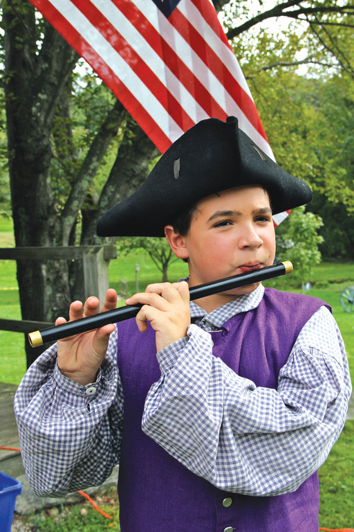 VINTAGE TUNES: Charlie Pike plays the colonial fife at the Revolutionary War Encampment Living History Weekend at the Smith-Appleby House this past Saturday and Sunday.