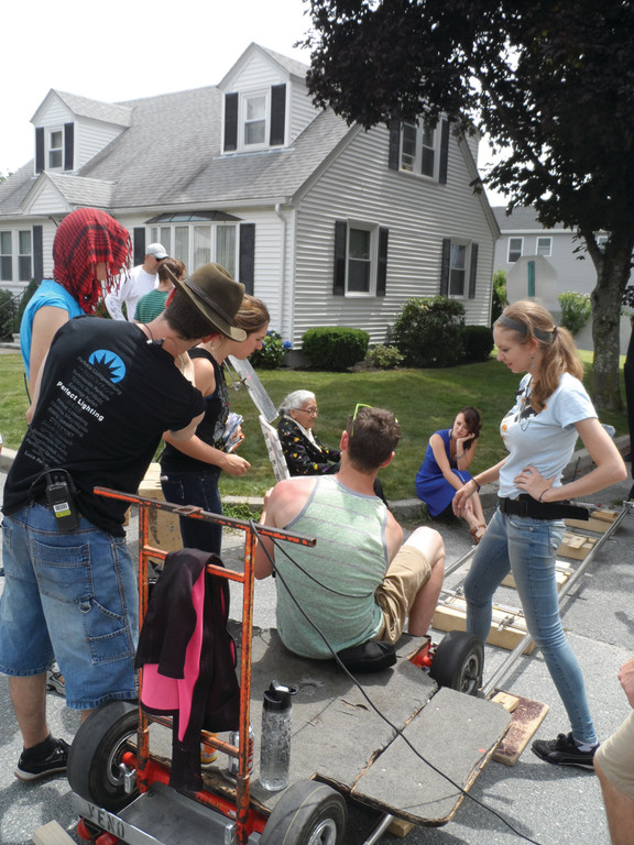 YOUNG FILMMAKER: Aly Migliori works with actors and crew members while shooting a scene for “Knightsville” on Saturday.