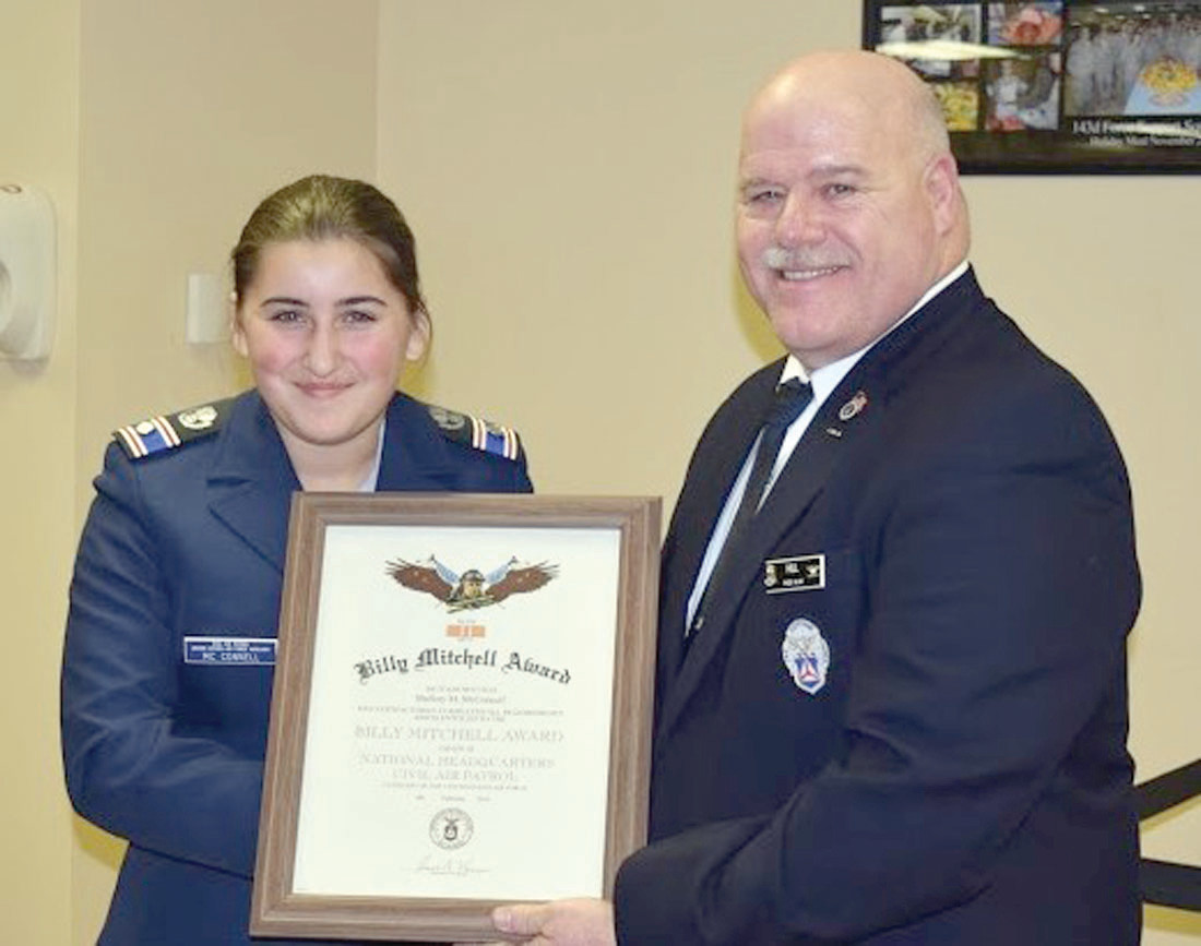 AT CEREMONY: C/2dLt Mallory L. McConnell (left) receives the Billy Mitchell Award from Col. Richard F. Hill, RI Wing Commander.