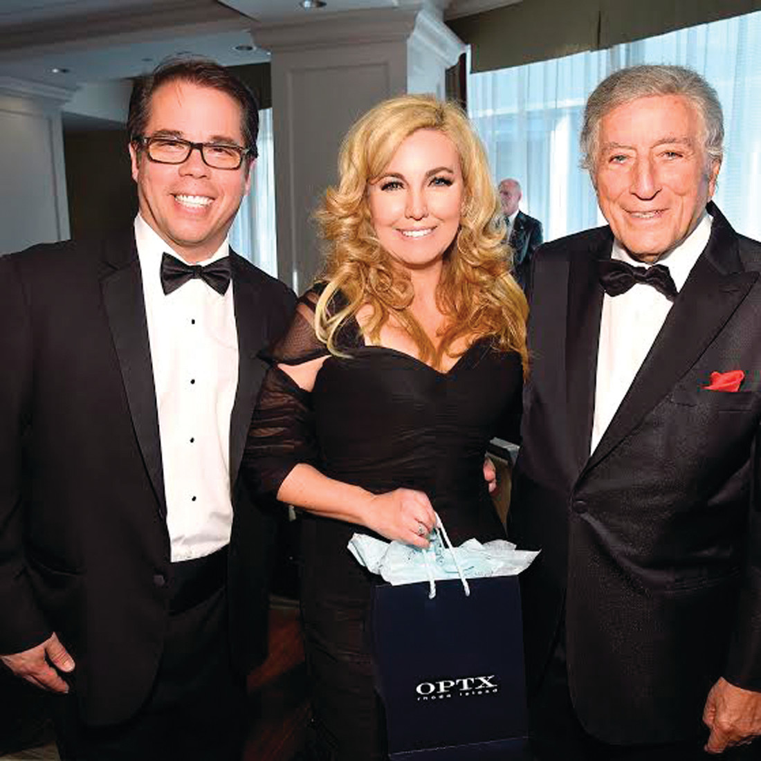 IN THE SPOTLIGHT: Legendary entertainer Tony Bennett, who’ll turn 90 on Aug. 3, joins OPTX Rhode Island owners Dr. Giulio G. Diamante and his wife Lynne Diamante, Esq., during their recent appearance at the Friars Club in New York City.
