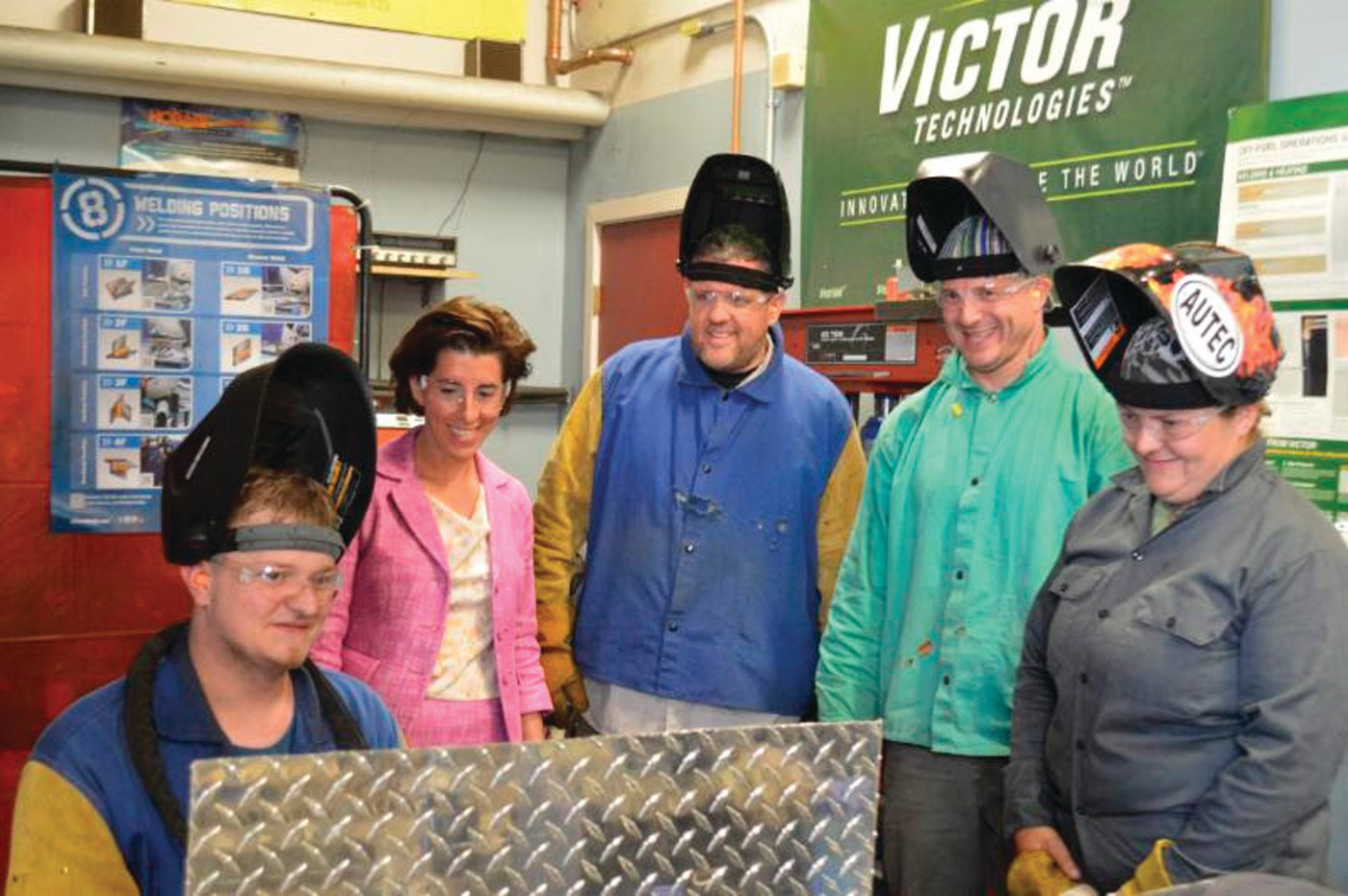NEIT TOUR: After the unveiling of the new strategic workforce development plan, Governor Gina Raimondo toured New England Institute of Technology’s welder program. Here, she watches several welding students at work.