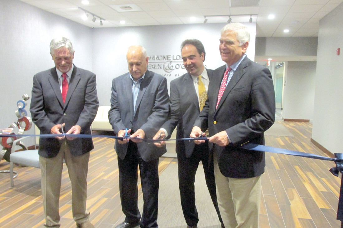 KEY CLUB: Mayor Joseph Polisena enjoys a lighter moment with William F. O’Gara during last week’s ribbon cutting ceremony at the law firm’s new headquarters in Johnston as Gary R. Pannone (left) looks on.
