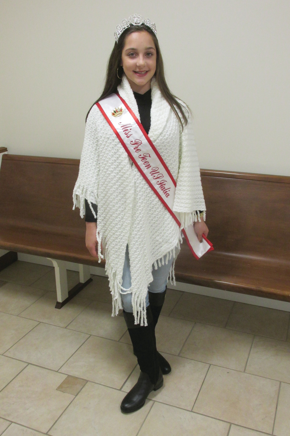 PERFECT POSE: Johnston’s Emma Salzillo, 14, shows off the banner she won during the recently Miss Italia US Pre-Teen Title, that came after her first-ever competition.