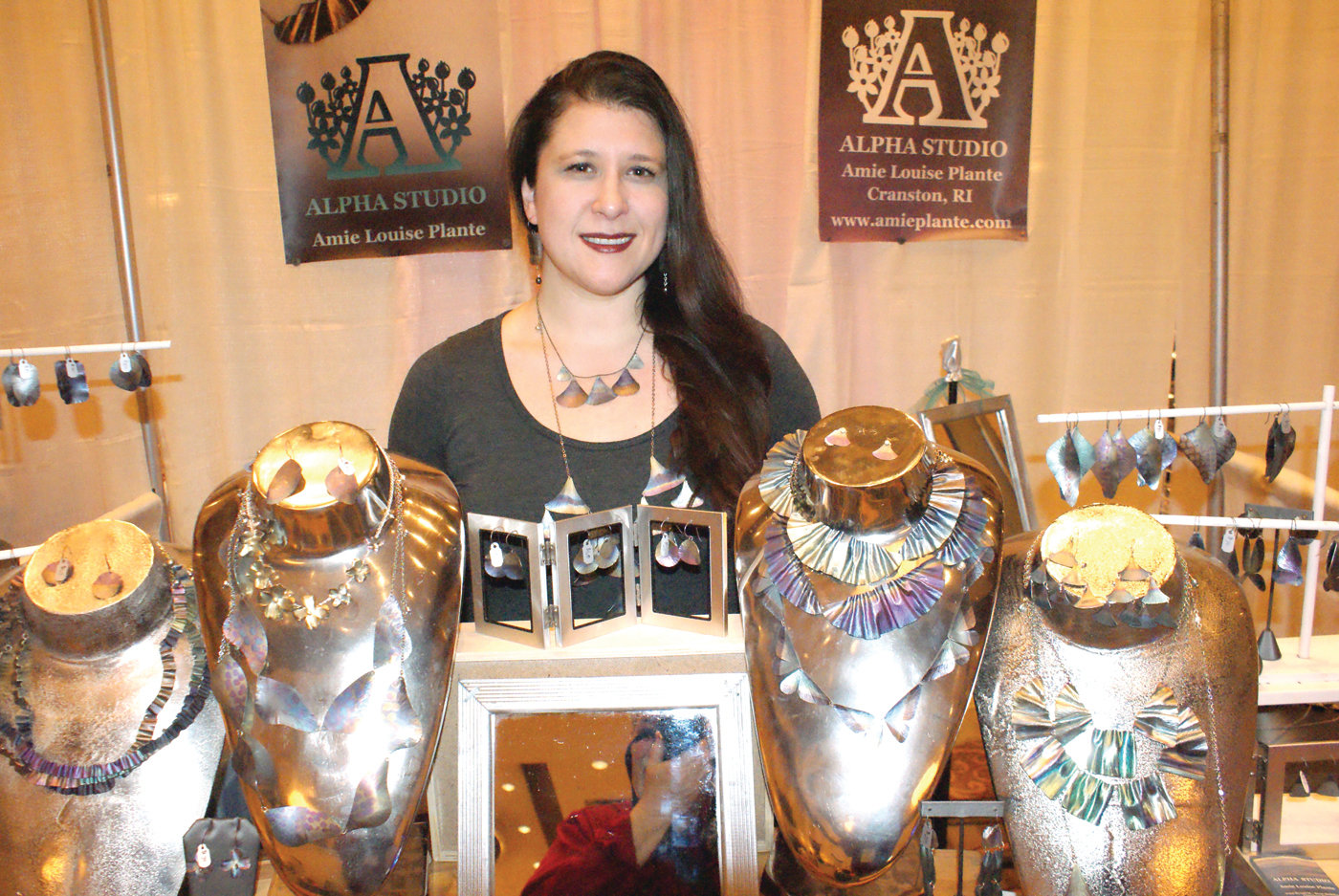 UNIQUE JEWLERY: At her display booth during the Rhode Island Women’s Expo at the Crowne Plaza was Annie Louise Plante, Owner and Designer of fine art jewelry, Alpha Studio located in Cranston.