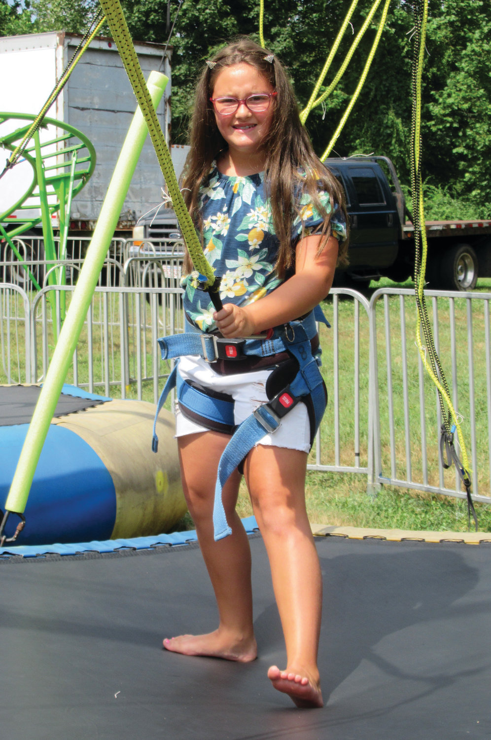 FUN AND GAMES: Gia Vescera, 8, gets set to test her mettle on the bungee cord during Sunday's visit to the Saint Rocco's Festival