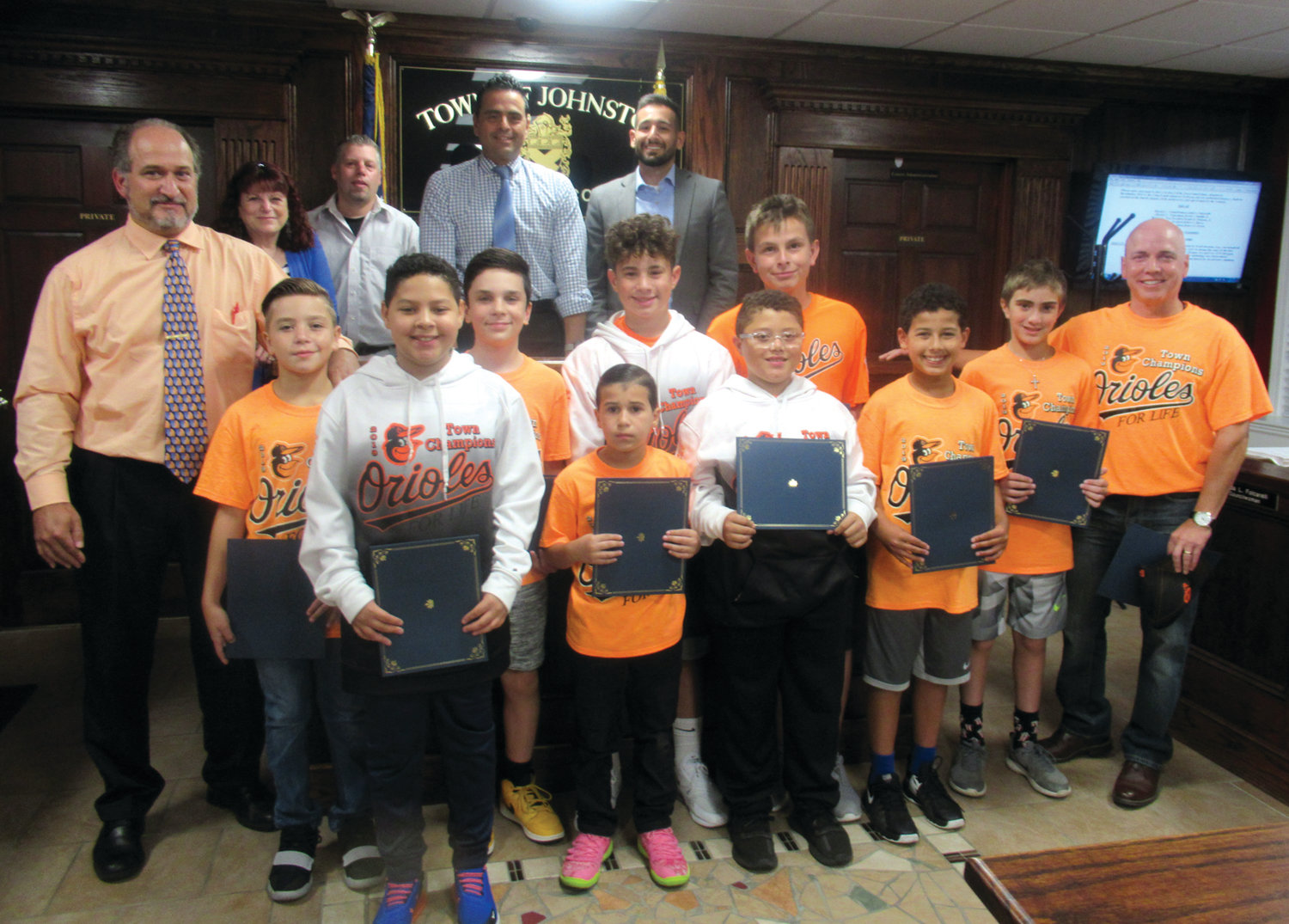 COUNCIL’S CHAMPS: Among the coaches and players who were honored by the Johnston Town Council Monday night are, in front from left: Councilman/coach Robert Civetti, Christian Ferrante, Jayden Calcagno, Max Mousseau, Fabian Aleman, Dean Paris, Antonio Morales, Tyler Holton, Anthony Vendetti, Assistant Coach Chris Civetti and Manager Mike Mousseau. Back: Council members Linda Folcarelli, David Santilli Jr., President Robert V. Russo and Joseph Polisena.