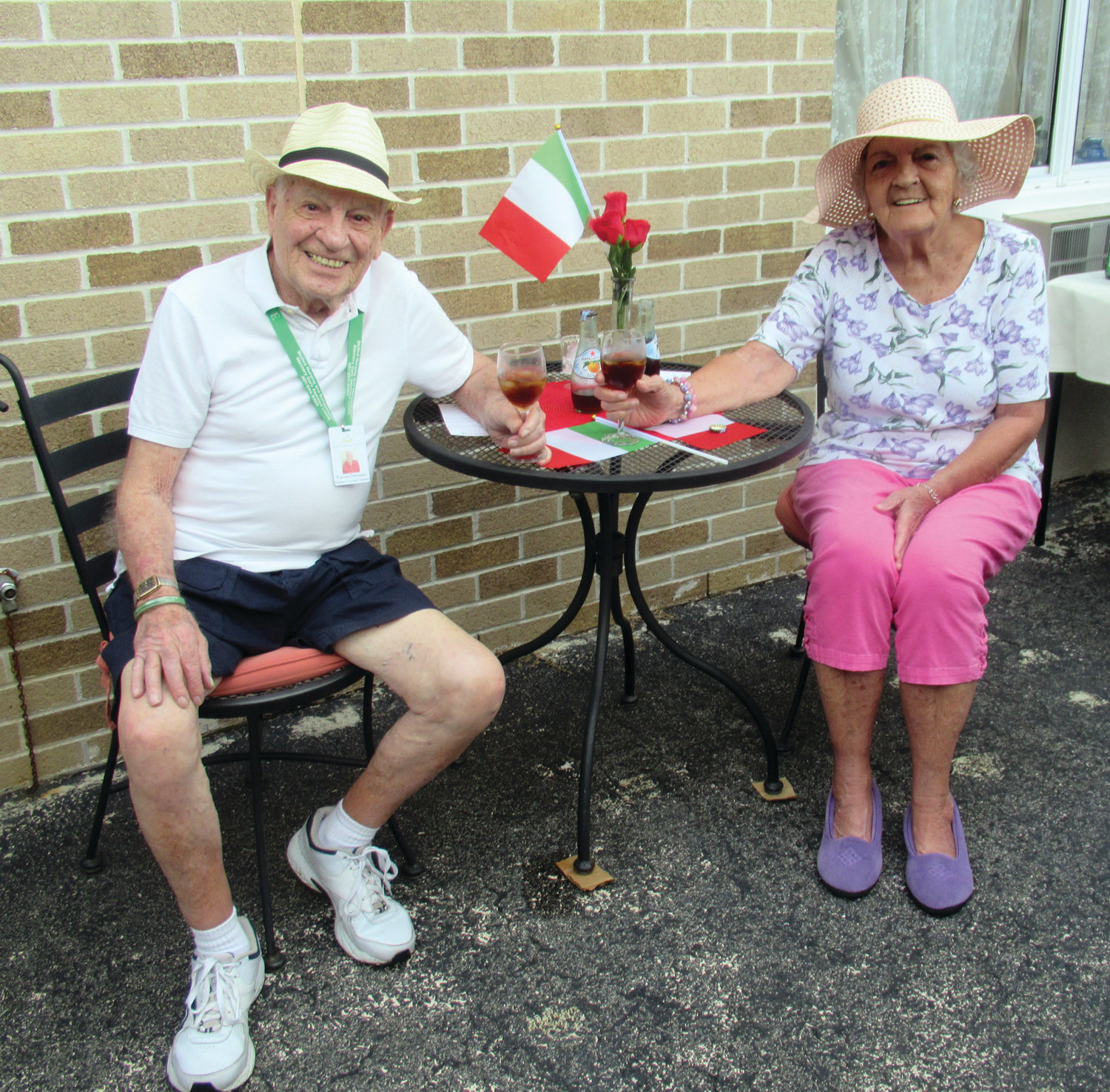 SALUTE! Briarcliffe Manor residents Vinny DiDonato and Doris Boucher offer a toast during Tuesday’s Taste of Italy. 