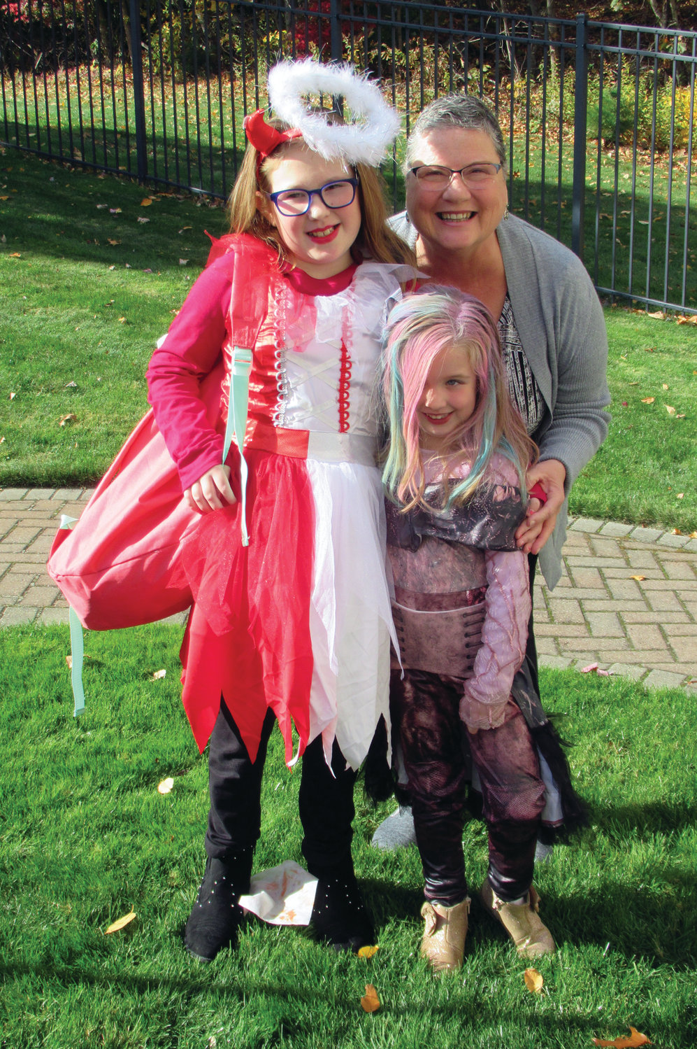 FAMILY FUN: Above, Carol March brought her grandchildren Morgan Harris and Liv Rose to Briarcliffe Manor Saturday so they could show off their classic costumes to their great-grandfather, Vinny DiDinato.