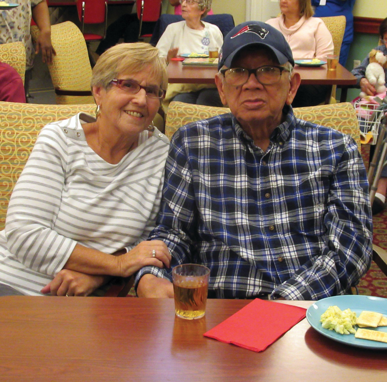 CLASSIC COUPLE: Cathy and Hector Lipa, who once owned and operated a catering business, enjoy the music of Vini Ames – who just so happened to sing at their golden anniversary party three years ago – during the Black Friday Party in Johnston.