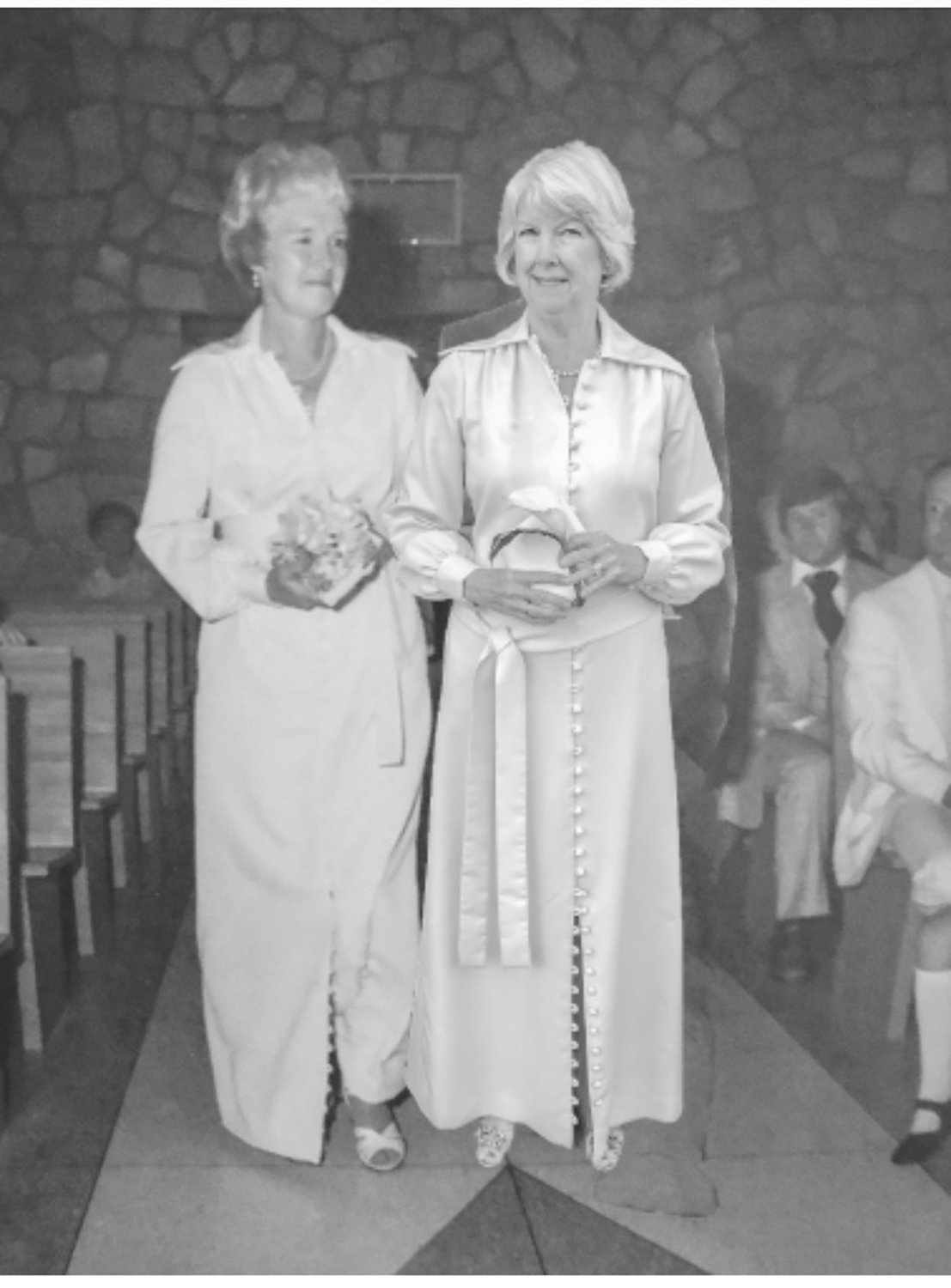 SHARED WEDDING DRESS: In glorious black and white, and across time, Liz Metroka and her mother, Alice Rooney, stand side by side in their shared wedding dress.