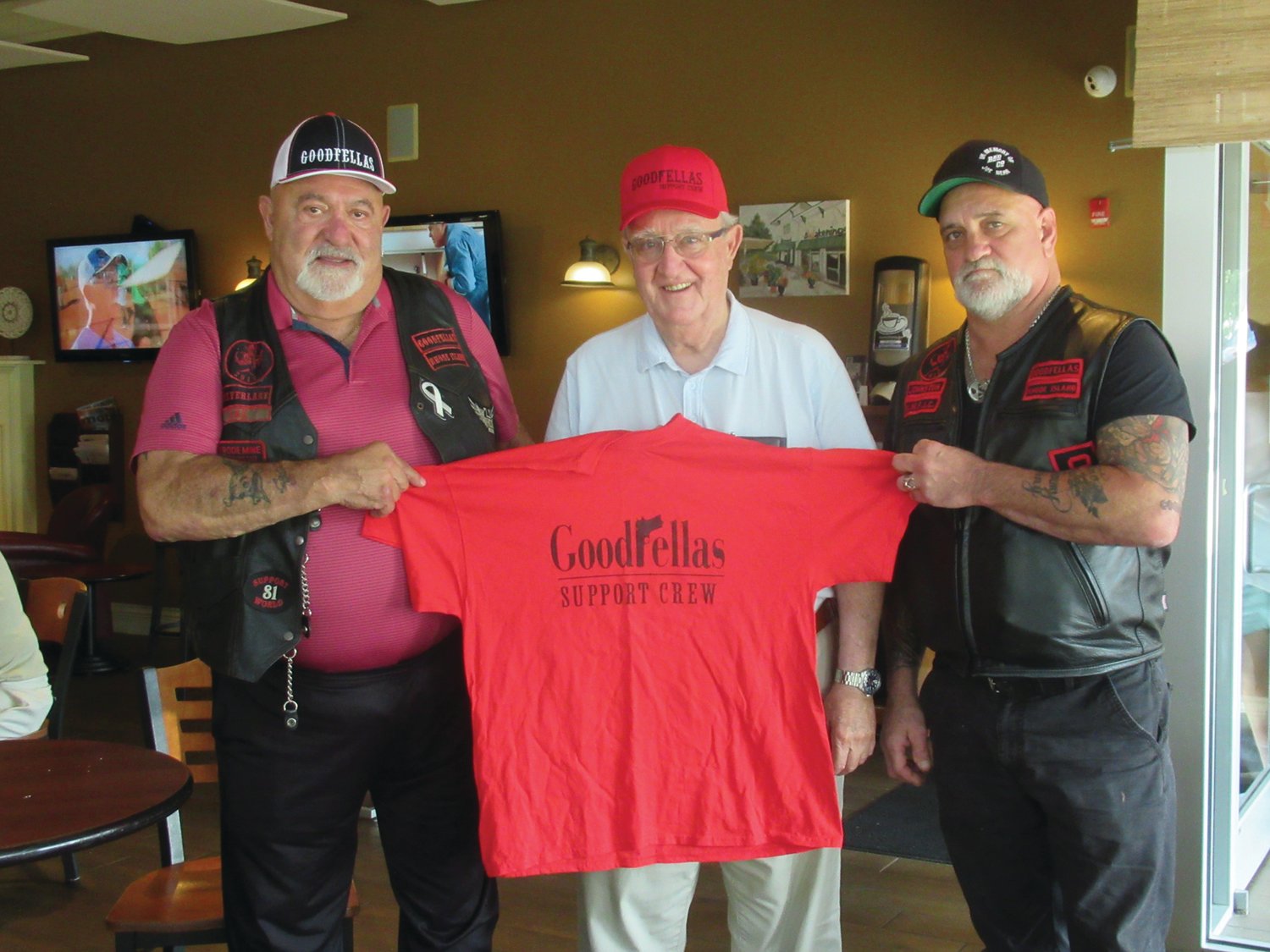 GENEROUS GUY:  Last year, Bruno Ramieri, center, held a special T-shirt he received from Goodfellas Motorcycle Club treasurer Cal Calabro, left, and president Gene Benedetti as thanks for his pledge to match up to $20,000 raised through the fifth annual Goodfellas Motorcycle Run. Ramieri has offered to do the same for this year’s run.