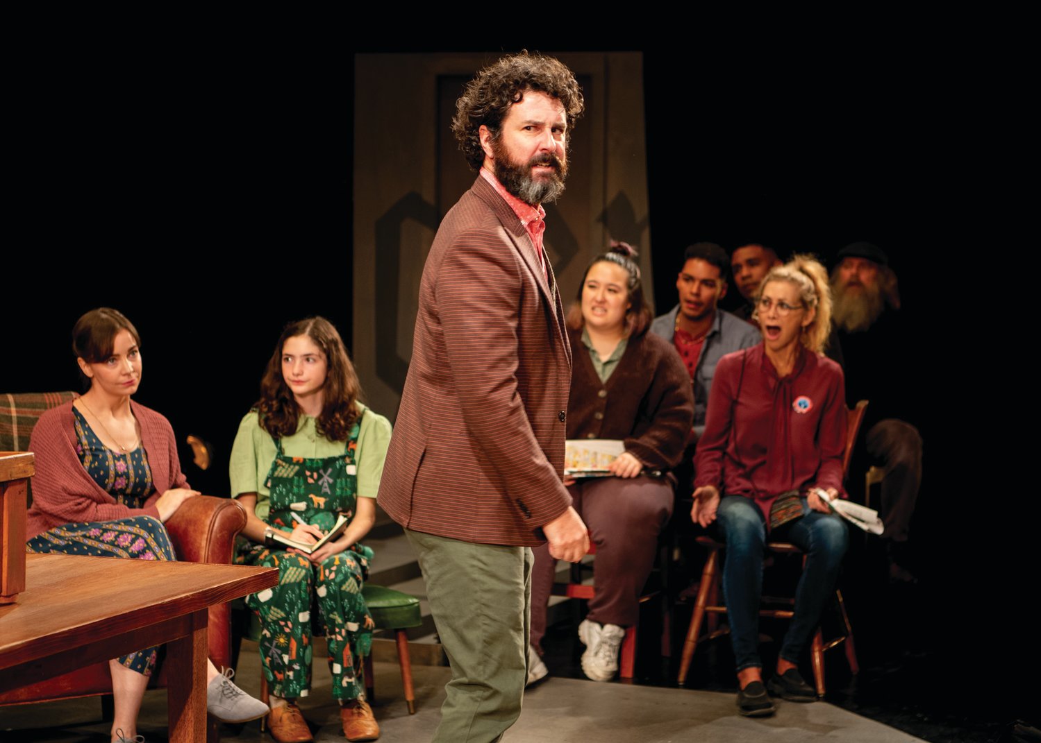 CENTER STAGE: Sean McConaghy (Dr. Thomas Stockman) “captures the stage” in “A Lie Agreed Upon,” writes Don Fowler. Pictured in the background, from left, are Donnla Hughes (Katherine Stockman), Aniko Moscarelli (Greta Stockman), Maria Noriko Cabral (Townsperson), Erik Robles (Townsperson) and Sarah Sinclair (Townsperson). LIE_press6 Jomo Peters (Captain Horster), Fred Sullivan Jr. (Aslaksen), Jonathan Higginbotham (Peter Stockman), Sean McConaghy (Dr. Thomas Stockman) Background L to R: Donnla Hughes (Katherine Stockman), Aniko Moscarelli (Greta Stockman) LIE_press7 Fred Sullivan Jr. (Aslaksen), Sean McConaghy (Dr. Thomas Stockman) Background L to R: Nora Eschenheimer (Thea Hovstad), Jeff Ararat (Billings)