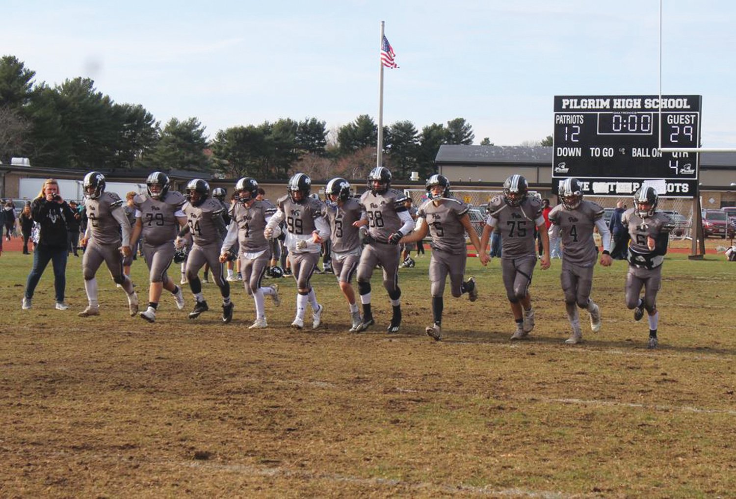 THE FINAL LAP: The Pilgrim football seniors take one last lap together after the conclusion of the 2021 Warwick Beacon Bowl last Thursday afternoon.