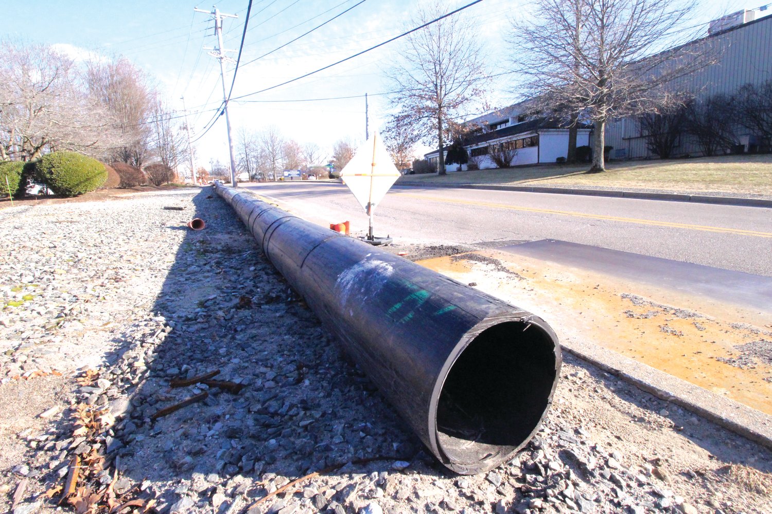 ONCE A BYPASS: The bypass to the Airport Interceptor sewer line stands ready to be removed now that that section of restoration to the buried pipe on Service Avenue is completed.