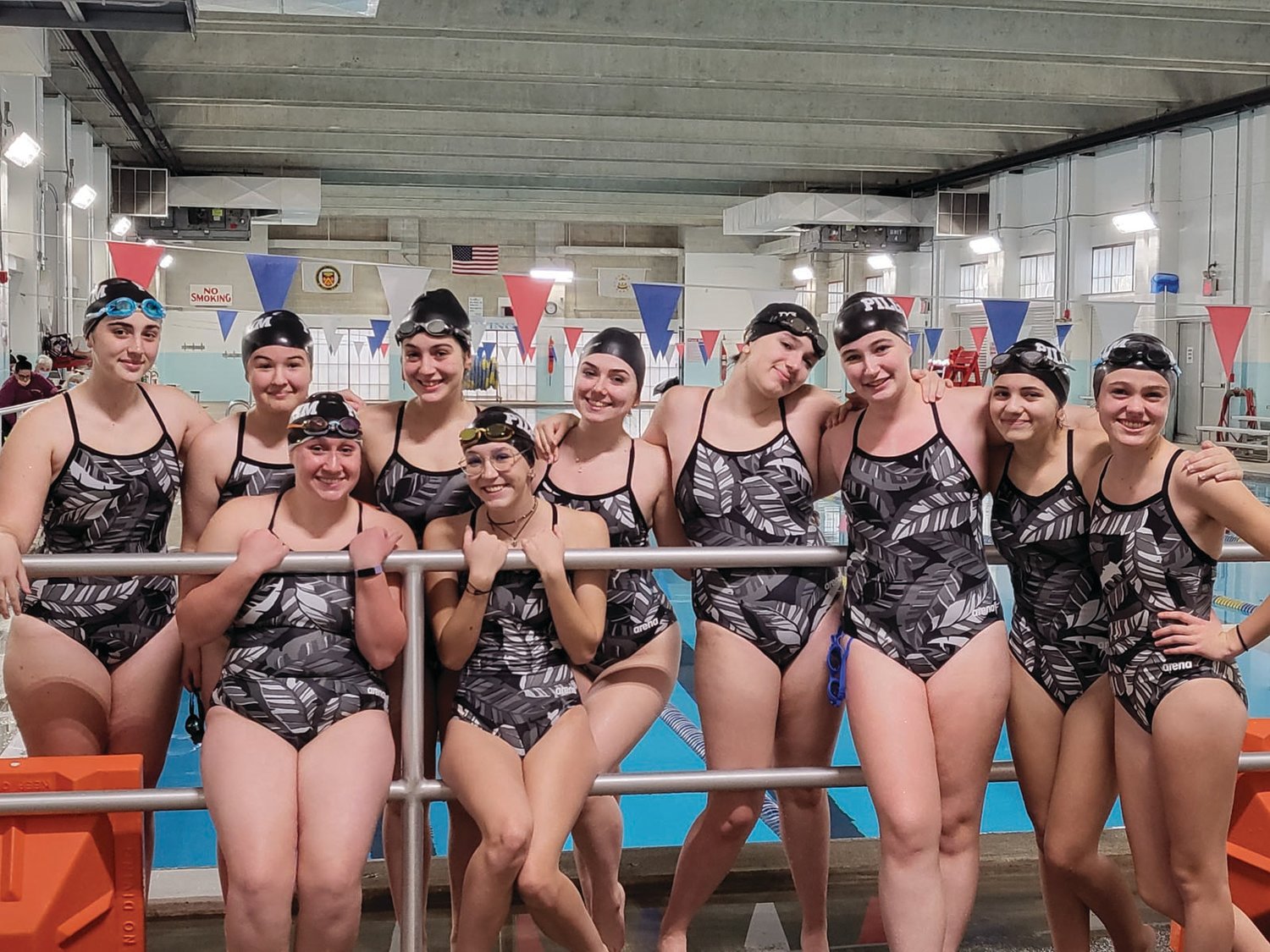 WRAPPING UP THE SEASON:
The Pilgrim girls
swim team takes a photo at
McDermott Pool at a recent
meet.