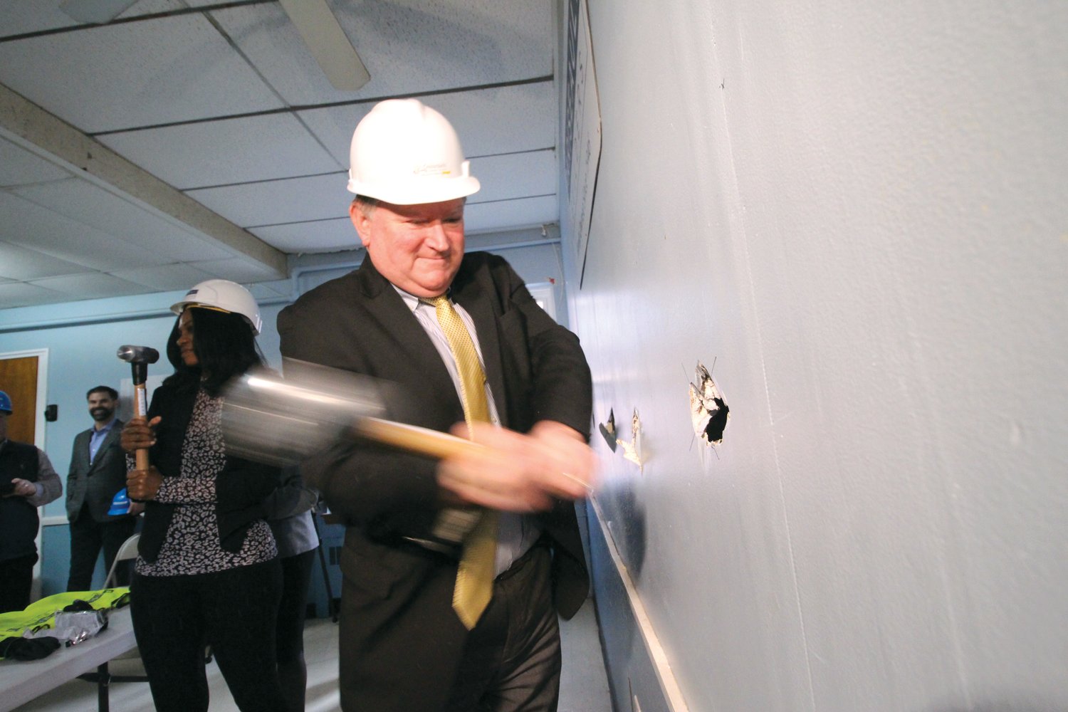 WALLBREAKING: Senate Majority Leader Michael McCaffrey was one of those in attendance for the wall breaking ceremony on Wednesday afternoon at the Beach Avenue Apartments. The apartments will help to bring more affordable housing in Warwick. The building was once the Rhode Island Family Shelter and before that was part of St. Benedict Church. (Warwick Beacon photos)