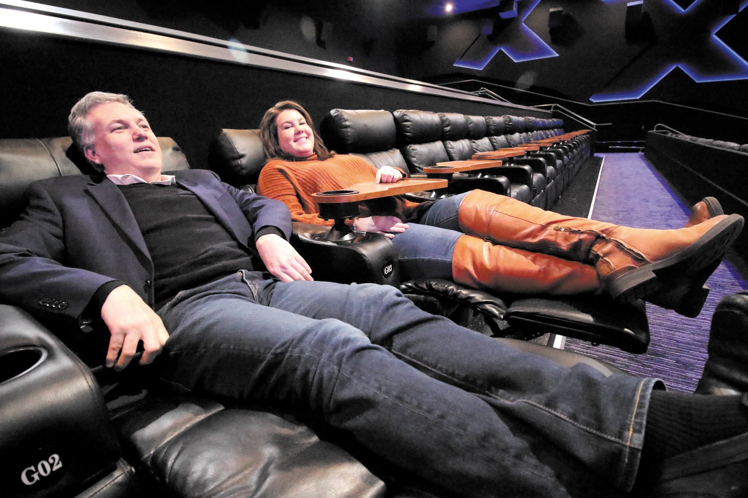 STRETCHED OUT: Mark Malinowski, vice president of Global Marketing for Showcase
Cinemas and Colleen McCormick Blair, who handles public relations for the company, relax
while discussing features of the XPlus theater. The first of the renovated auditoriums seats
170. Malinowski guaranteed viewers won’t be falling asleep during the 3-hour “The Batman”.
“There’s too much action,” he said.