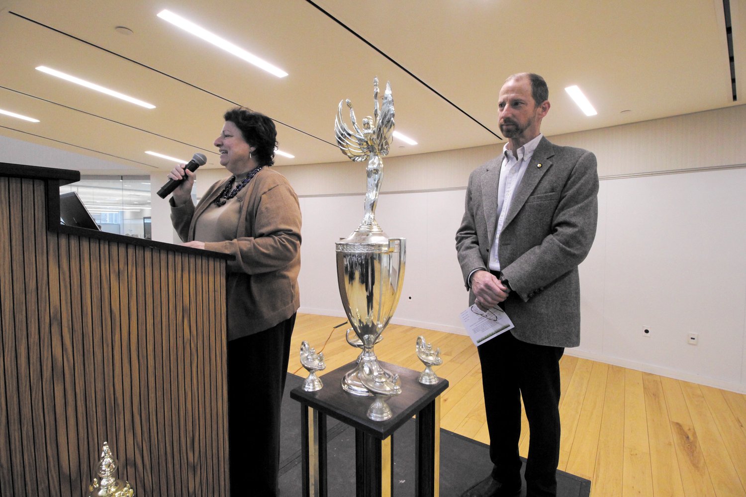 Inge Ameer, vice president of Student Affairs at Bryant welcomes Rhode Island Academic Decathlon teams to the competition. Standing with her is Frank Lenox, RIAD executive director. (Cranston Herald Photos)
