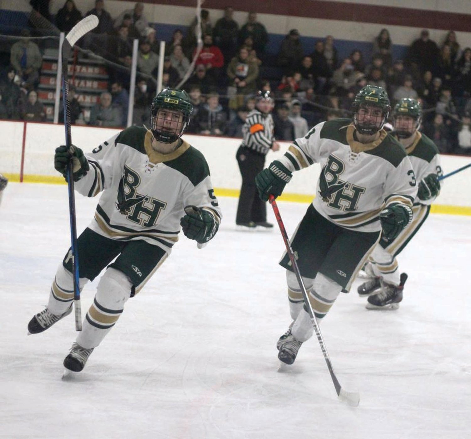 PULLING OFF THE UPSET: Bishop Hendricken’s Drew Gayman and Griffin Crain celebrate after scoring a goal against La Salle in the DI Semifinals last week at Thayer Arena.