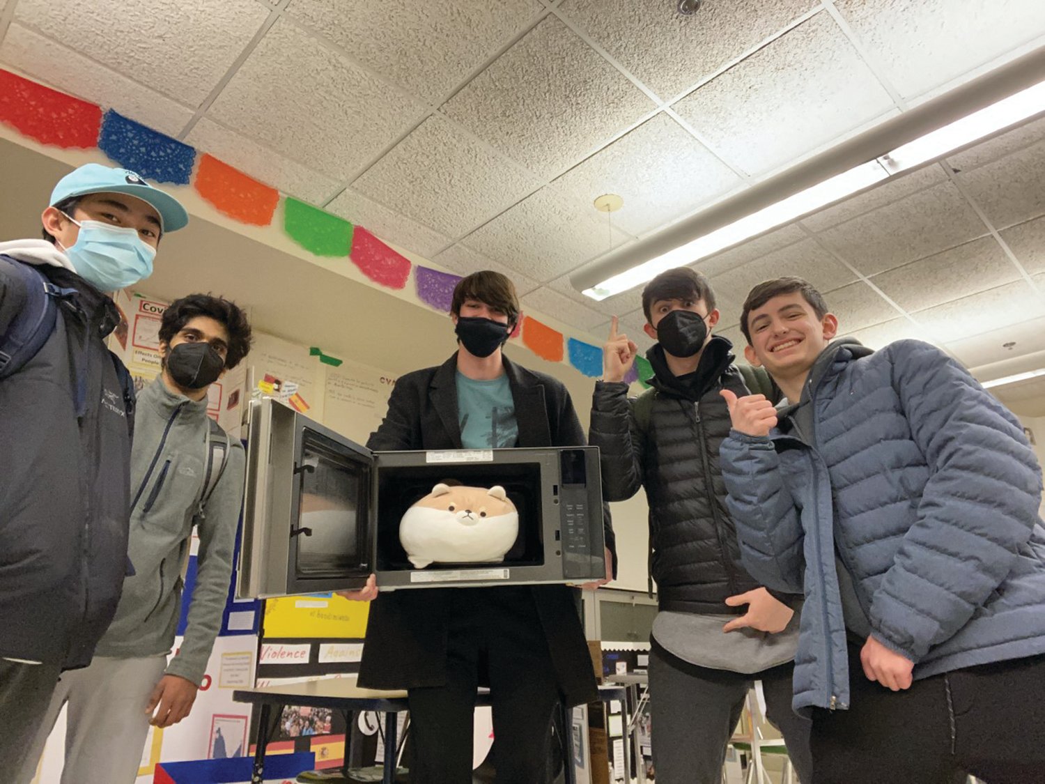 BRINGING THE HEAT: (left to right) Neil Joesph Dungca Jr., Atul Thyvalappil, Samuel Alexander Warr, Jacob Rademacher, and Aaron Lewis prepare for the long challenge with a microwave to help them prepare food for the next 14 hours.