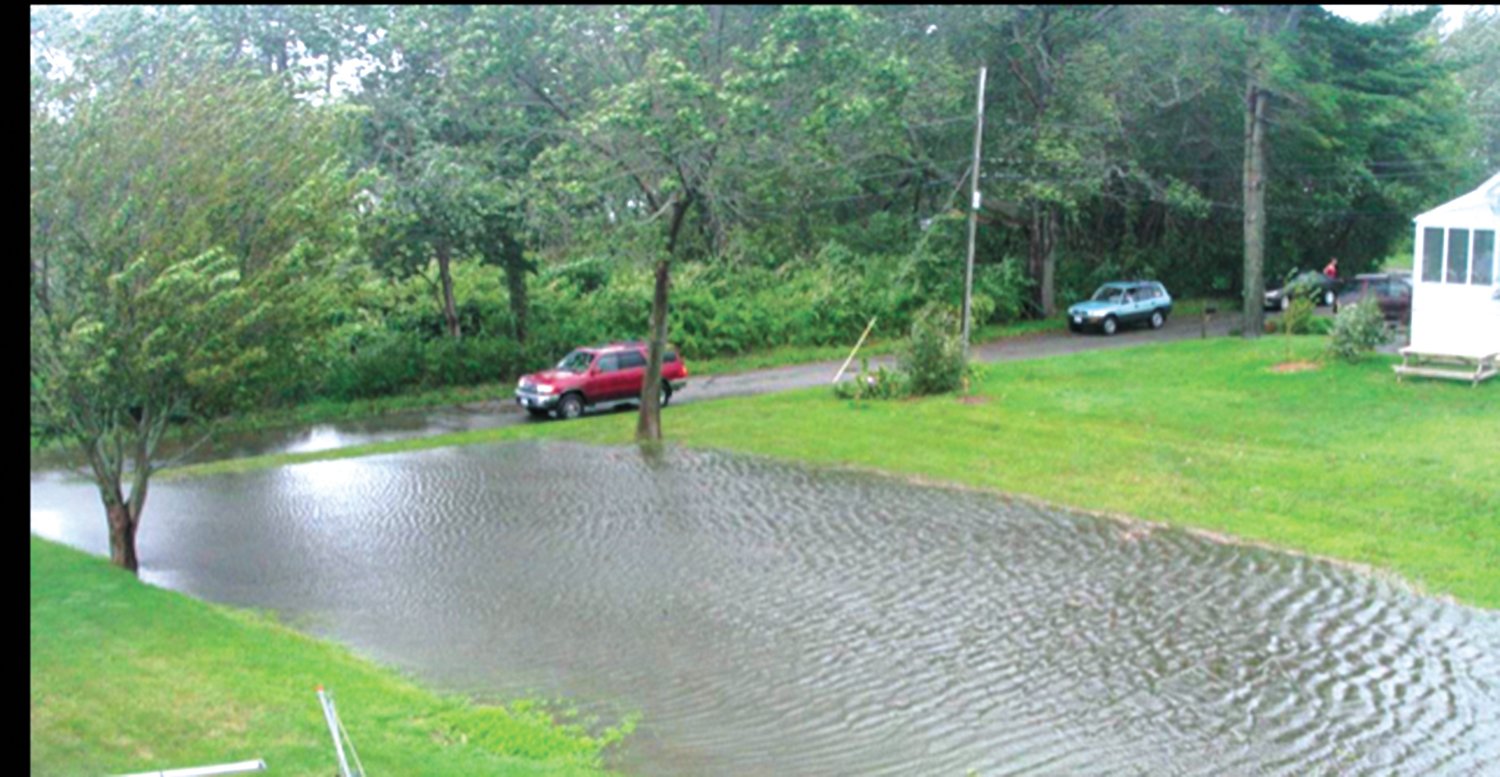 STORM CONDITIONS: Jeanne Mutokyle has questioned how CRMC and DEM could approve construction on the lot that is flooded by rising bay waters and during severe weather. She provided these photos.
