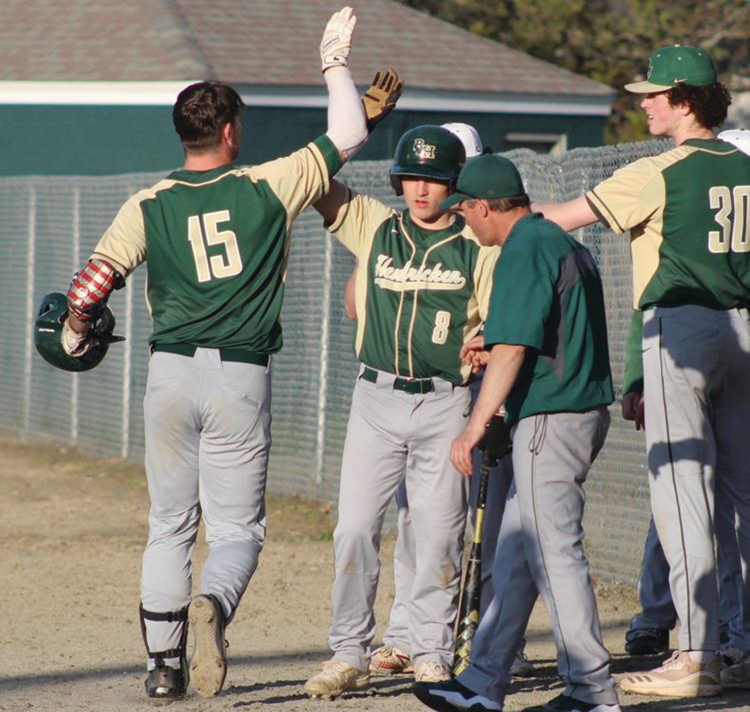 STAYING HOT: Hendricken players celebrate after a home run on Monday. (Photos by Alex Sponseller)