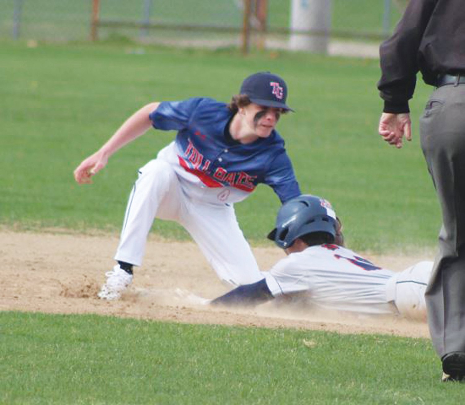 APPLY THE TAG: Zach DeCorpo tags a runner out at second base.
