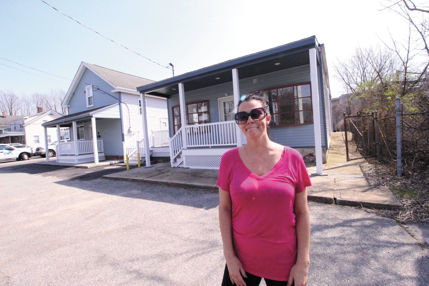 TOO CLOSE FOR COMFORT:  Alisha Covill, a tenant across Kilvert Street from what was Track 84 about a decade ago and the abutting building that operated for years as the Sandwich Junction, is opposed to plans to use one building as a tavern and the other as a cigar bar. (Warwick Beacon photo)