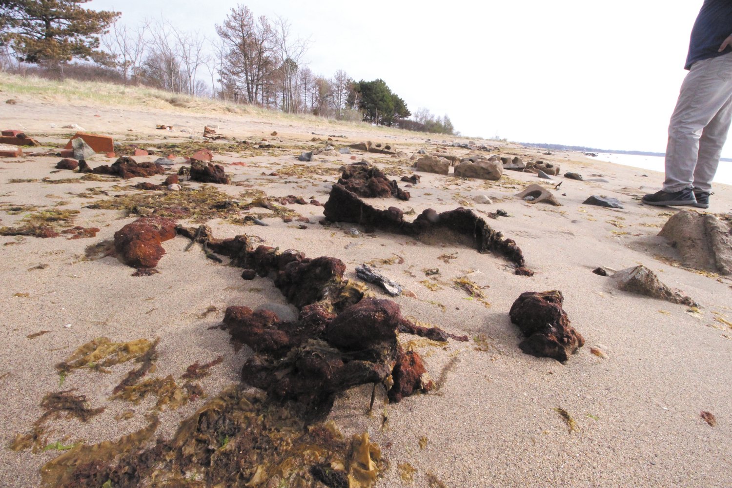 EXPOSED: With the loss of an estimated two feet of sand over the winter, the foundations of homes washed away by the 1938 Hurricane have resurfaced on Conimicut beach.