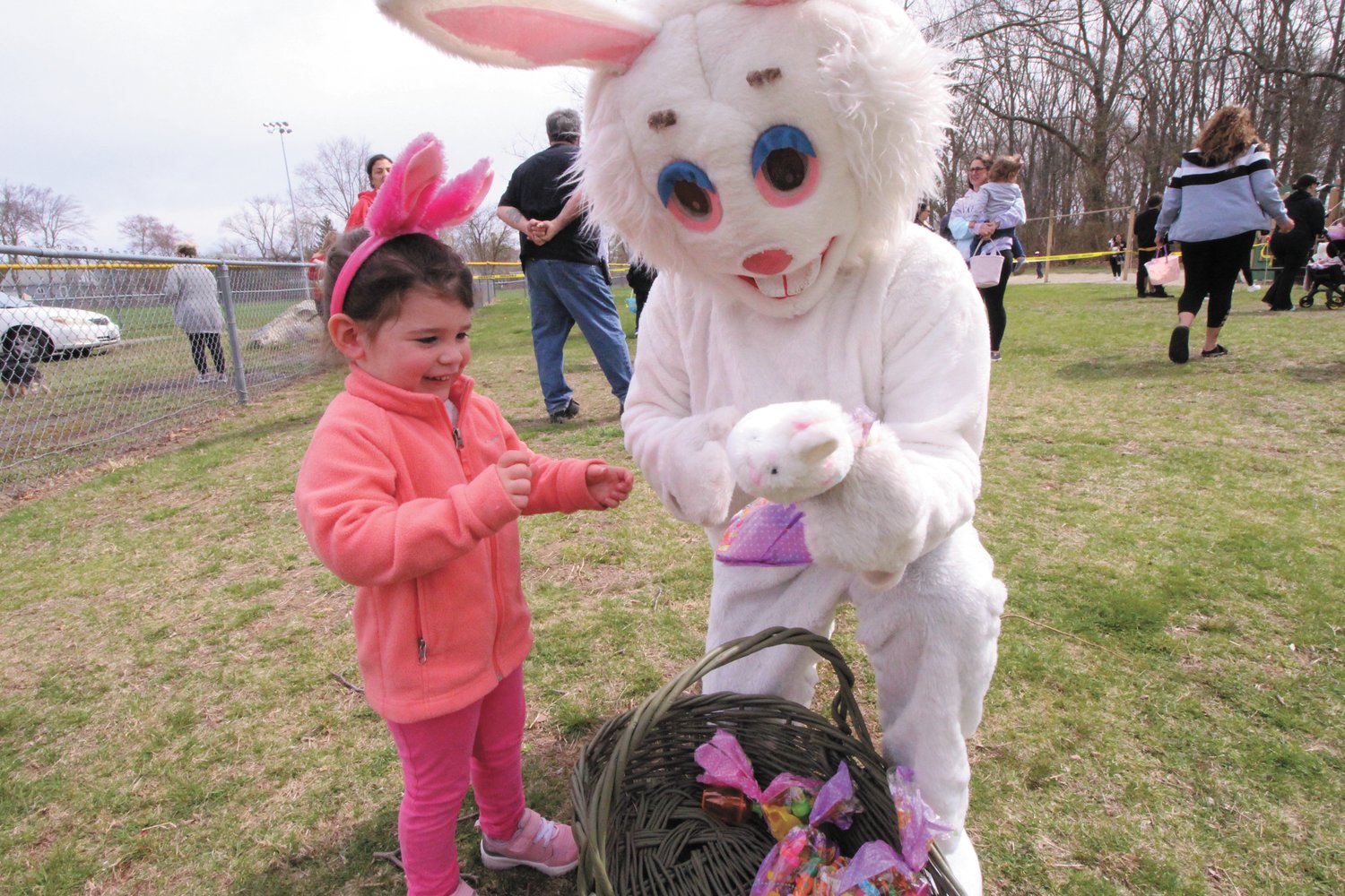 BUNNY FOR A BUNNY: Three-year old Catherine Barbeau offered to give her bunny to the Easter Bunning at the Conimicut Village hunt. (Warwick Beacon photos)