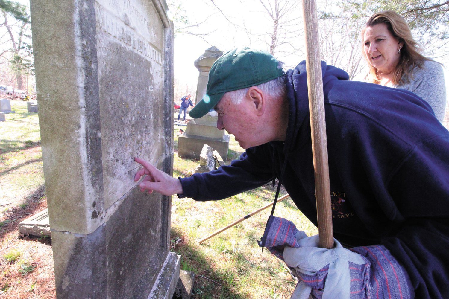 He knows are the bodies are buried 
Retired Supreme Court Justice and former Warwick Mayor Francis Flaherty joined fellow Warwick Historic Cemeteries Commission members and volunteers Saturday for the spring cleaning of the Brayton Cemetery in Apponaug. Flaherty seen here with Susan Cabeceiras reads the inscription on the William Brayton who served as a Rhode Island Congressman from 1856 to 1860.  Flaherty will give a talk on the Braytons at the May 14 event at the cemetery that includes a scavenger hunt.