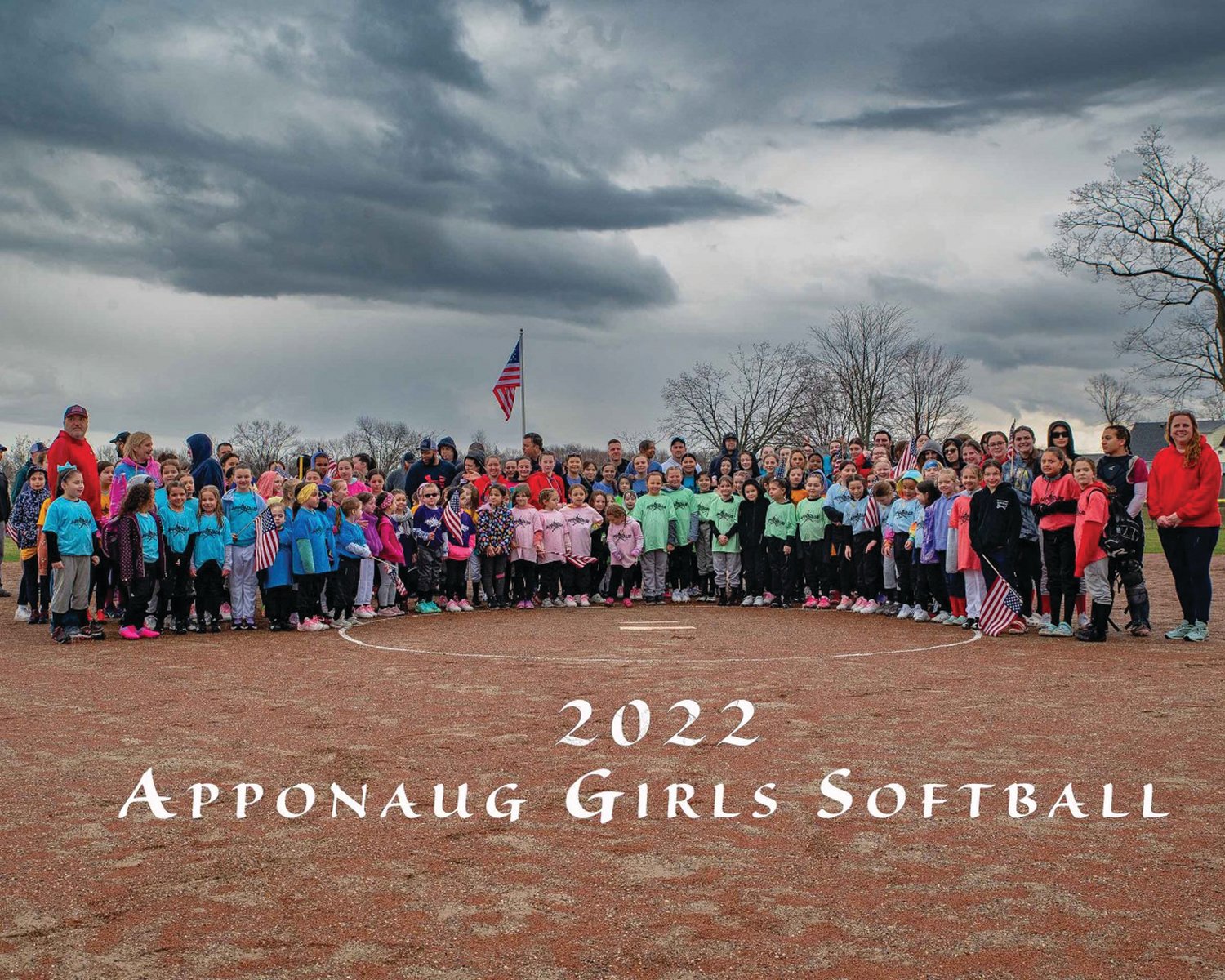 OPENING DAY FUN: Players and coaches of Apponaug softball gather for a photo on Opening Day.