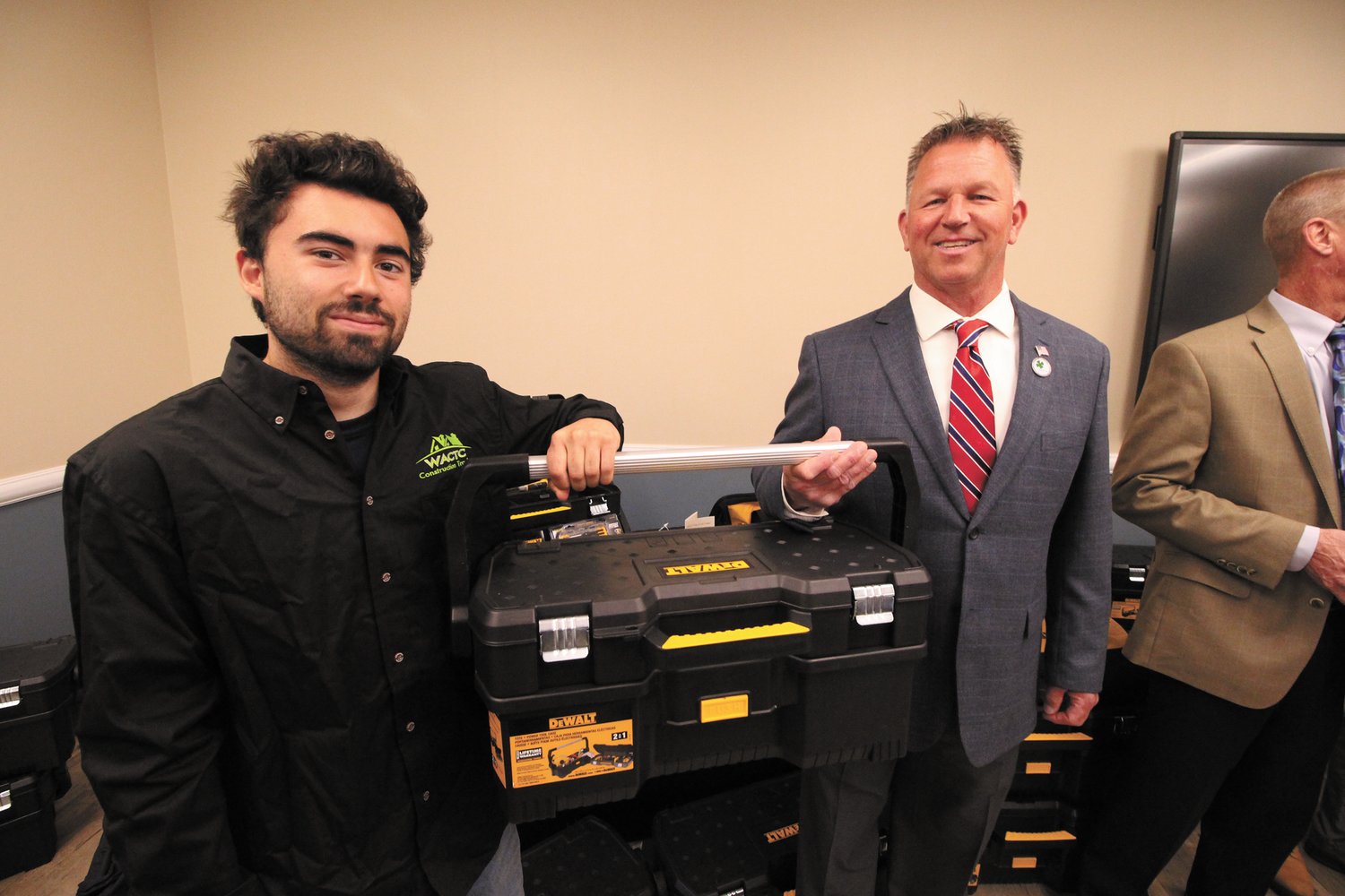 JOB READY: John Raposo of the Warwick center shows off the tool box he and other students received from Stanley Bostitch as presented by Chuck Phelps.