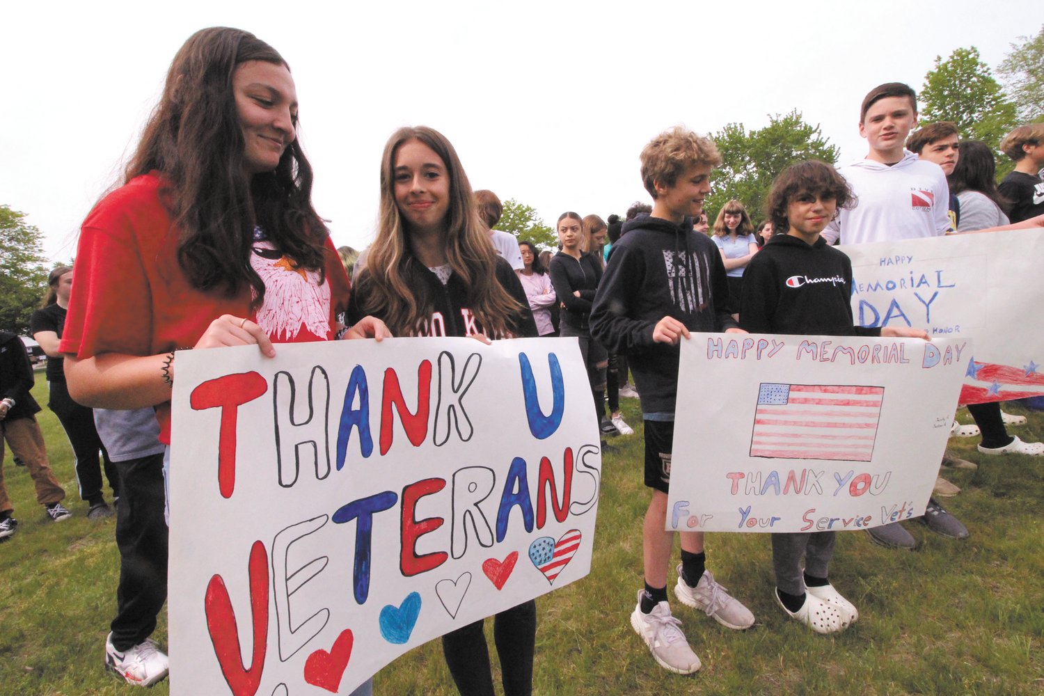 SIGNS OF APPRECIATION: Vets Middle School 8th graders Gabby Mota and Taylor Mooney were among students making signs to welcome veterans attending Tuesday’s remembrance.