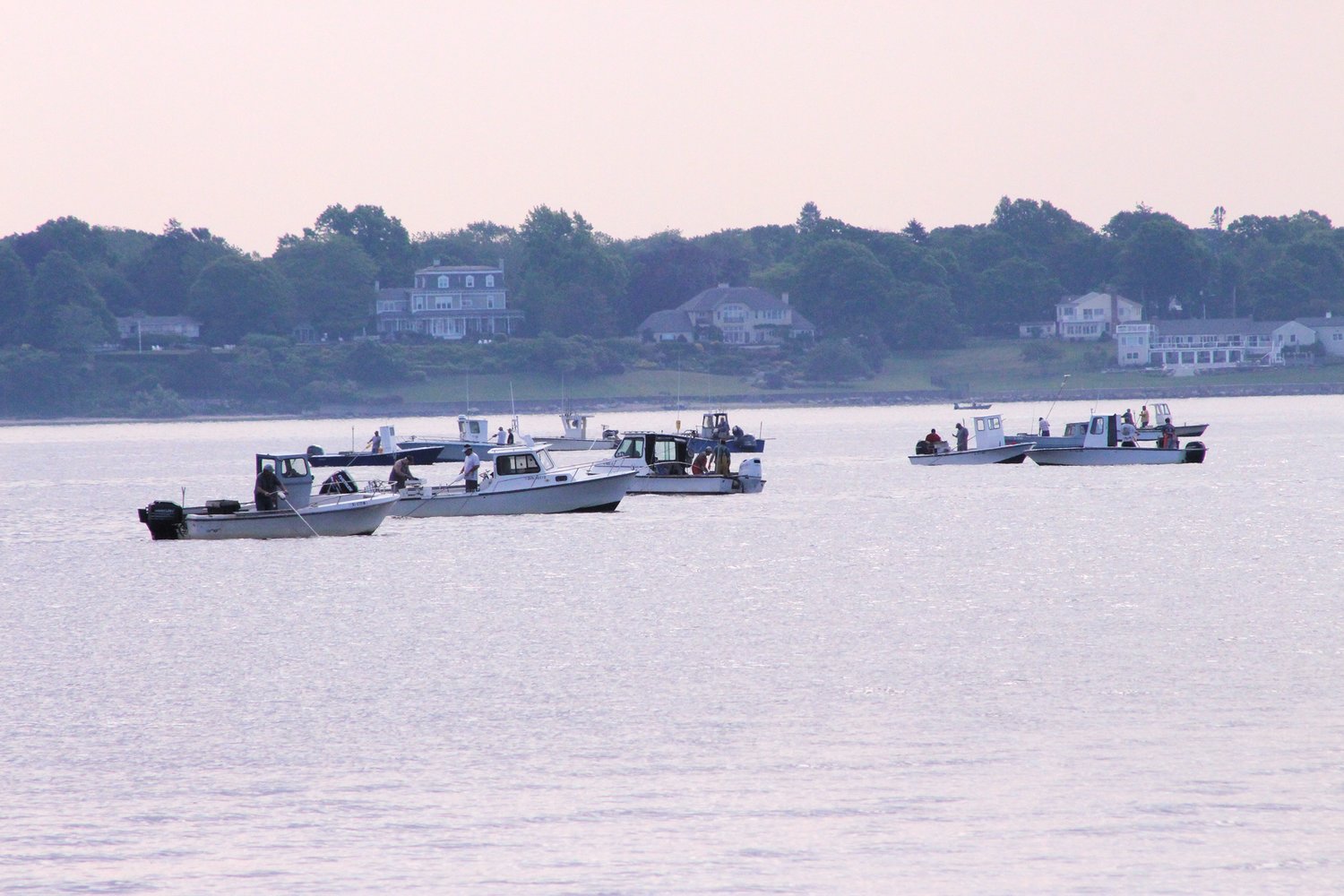 A QUAHOGGERS’ ARMADA: More than 100 quahoggers are turning out to fish the highly productive Area E of the Providence River north of Conimicut Point. The area opened for a first time in 75 years last summer when as many as 193 boats were recorded on one day.  So far, shellfishermen have focused on Conimicut, seen here, off Gaspee and Bullock’s  Point to the east.