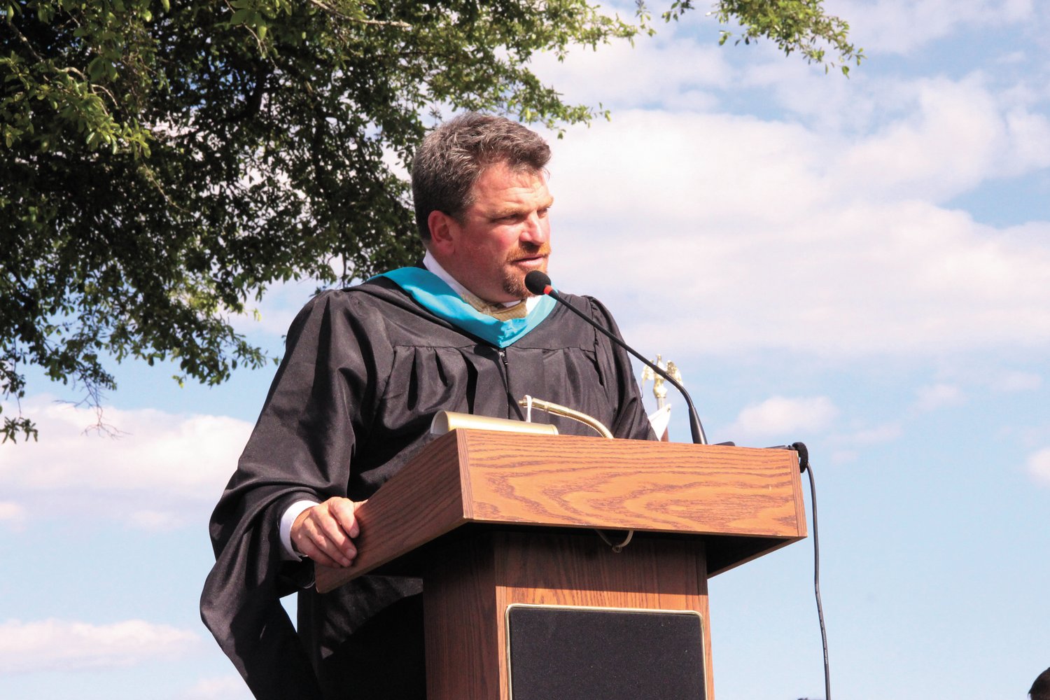 Pilgrim Principal Tobby Gibbons addresses the Class of 2022 during Tuesday afternoon’s graduation.