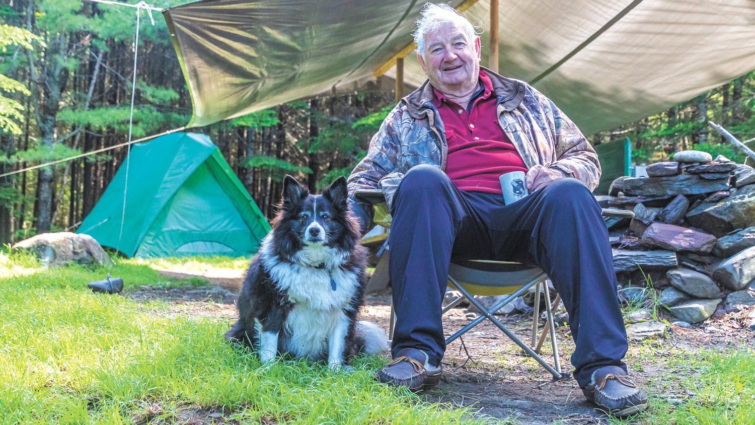 TRAIL ANGEL: Stephen Leavitt and his dog Penny who the trio met on Thoreau Island in Eagle Lake and whose generosity helped them tackle the last leg of the trail.