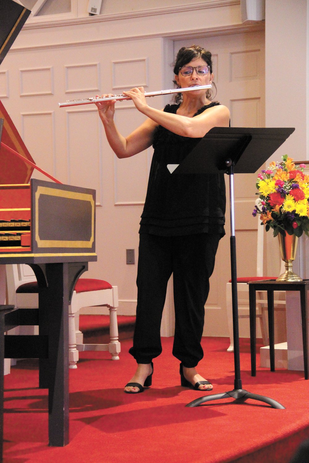 ON HER TOES: Dr. Mary Ellen Kregler, professor of music at RIC, was on her toes as she played the high notes to a Bach flute sonata.