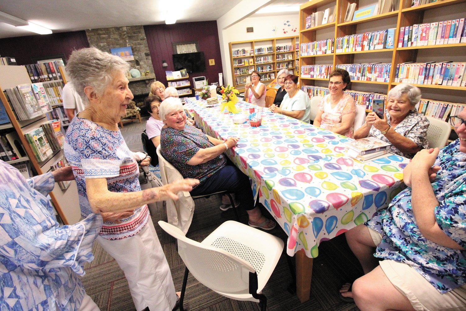 KNITTING FRIENDS: The knitting club that meets weekly at the Conimicut Library celebrated Betty’s birthday last Wednesday. Mayor Frank Picozzi stopped in to wish Betty happy birthday, which delighted her.