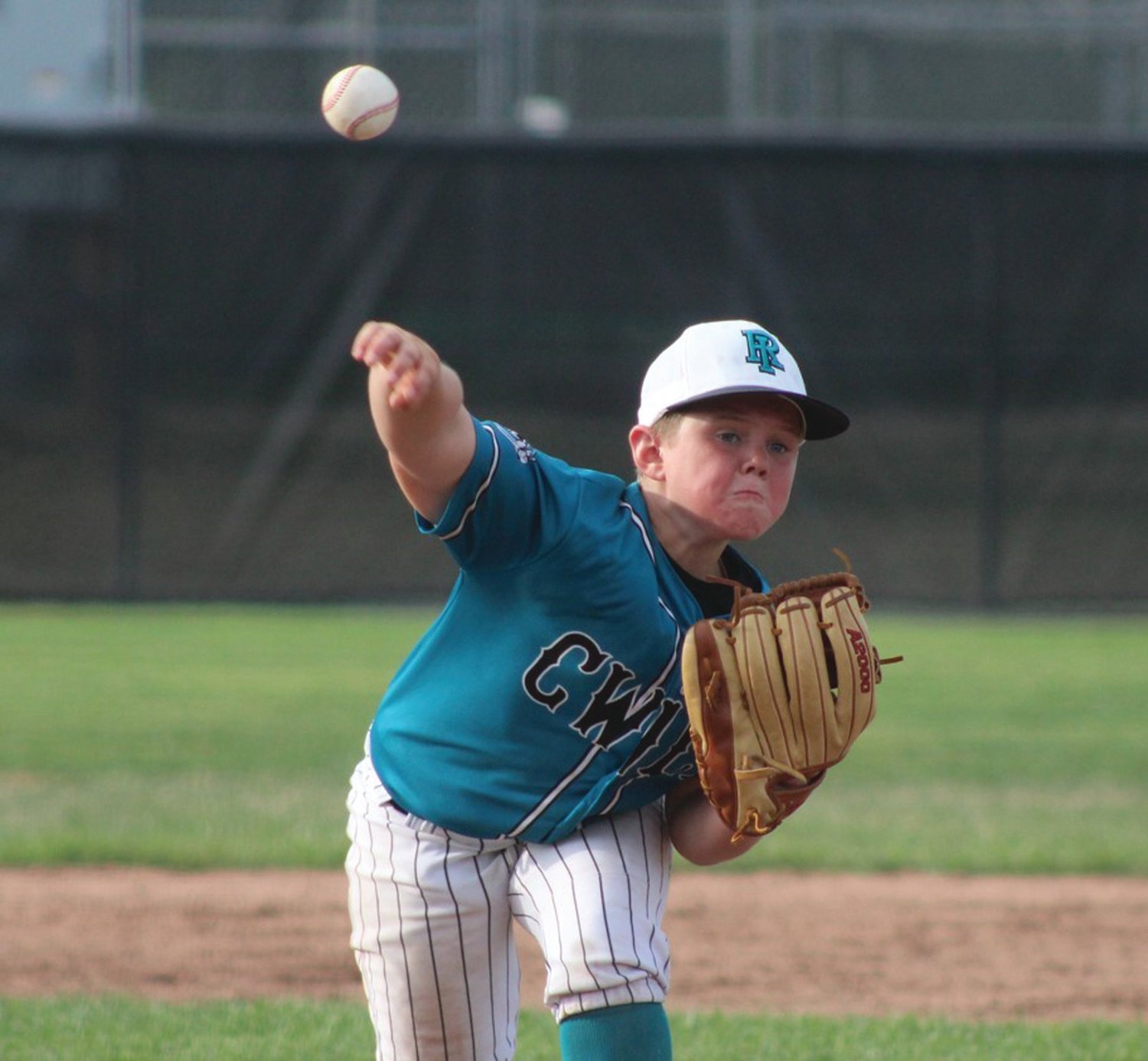 TOE THE RUBBER: CWLL’s Nolan Winters delivers a pitch. (Photo by Alex Sponseller)