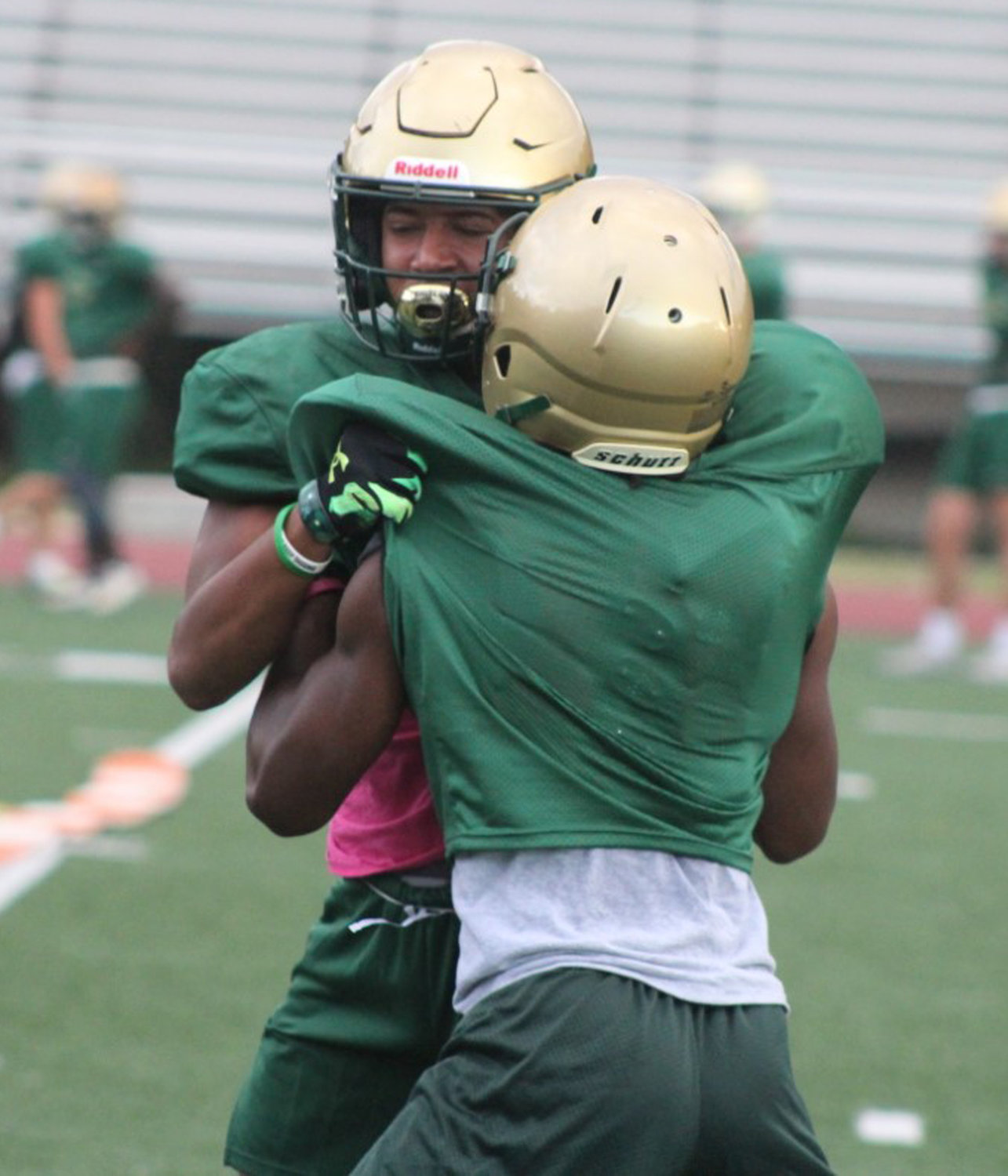 BACK IN CAMP: Hendricken players engage in blocking drills at practice. (Photos by Alex Sponseller)