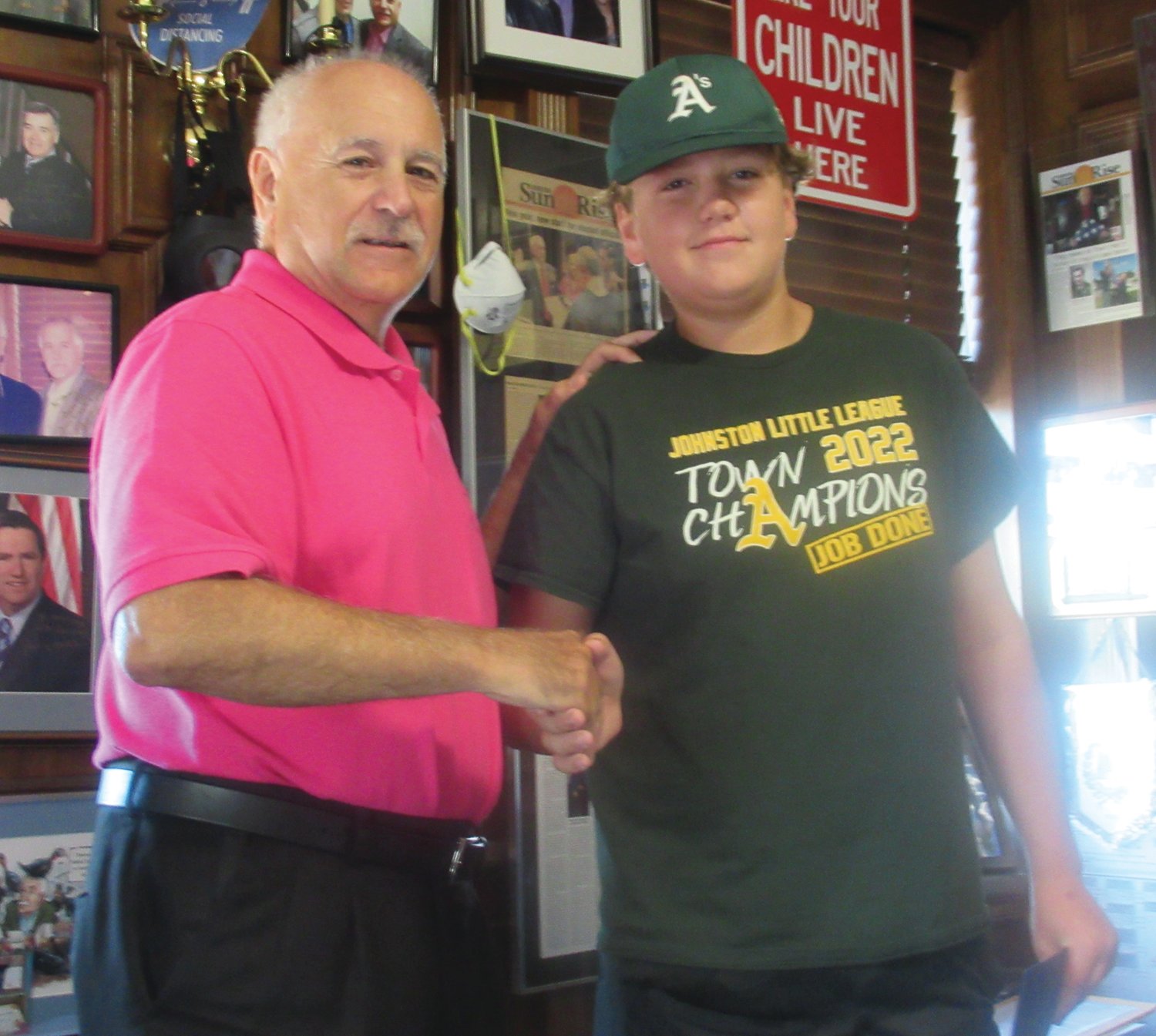 LINKED LEADERS: Mayor Joseph Polisena congratulates Athletics Aiden Neil Captain for winning the 2022 Town Championship during last Thursday’s ceremony inside Town Hall.