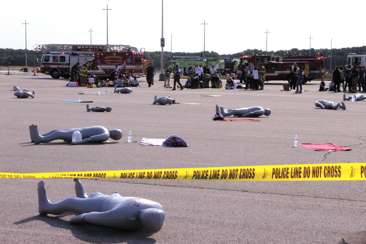 CASUALITIES: Inflated mannequins served as fatalities during the emergency exercise depicting the fiery landing of an aircraft carrying 129 held Saturday at Green Airport.  (Herald photo)