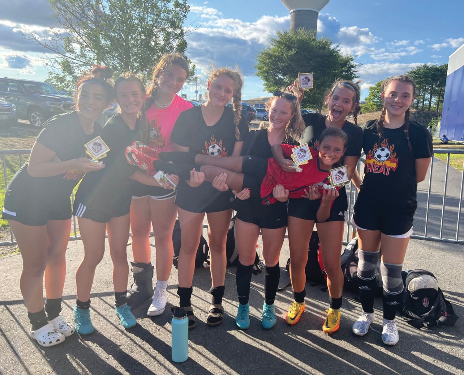 16-U CHAMPS: The WFFSC 16-U team that won at the Revolution tournament included: Ava Fischer, Madison Adams, Sloan Hogan, Jadyn Moore, Isabella Cambio, Lorelai Leddy, Emma Rattigan and their biggest supporter Layla Cambio (being held).
