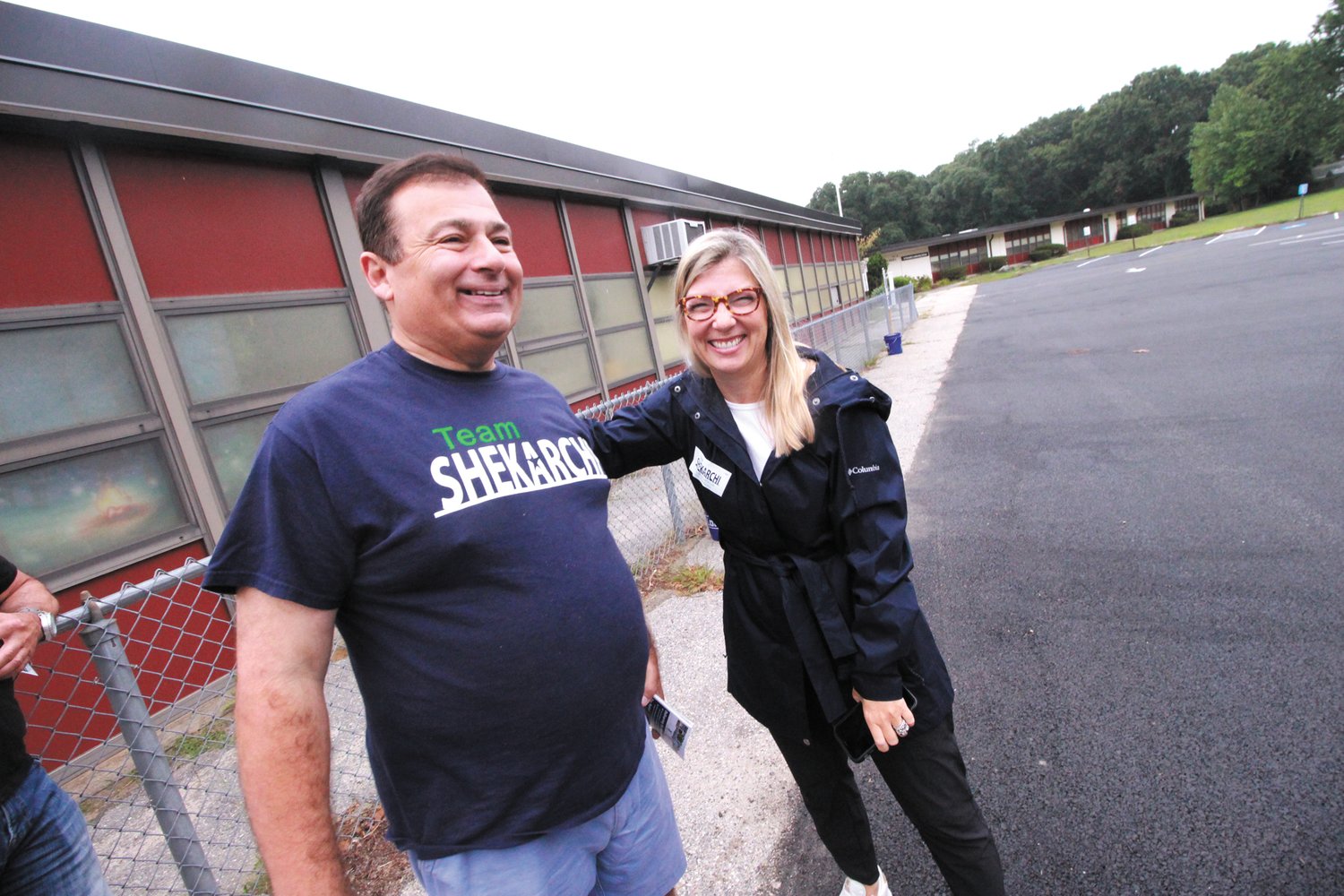A PAT ON THE BACK: Nicole McCarty greets House Speaker K. Joseph Shekarchi outside the Park School poll early Tuesday morning.
