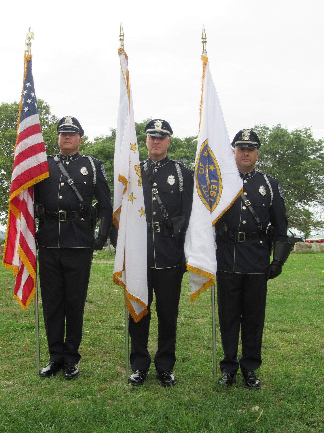 CLASSY COLORS: The Warwick Police Color Guard was one of several units that took part in Sunday’s 9/11 remembrance at the Oakland Beacon Memorial Park Monument. The officers are, from left: Damian Andrews, James Vible and Adam Arico. (Warwick Beacon photos by Pete Fontaine)