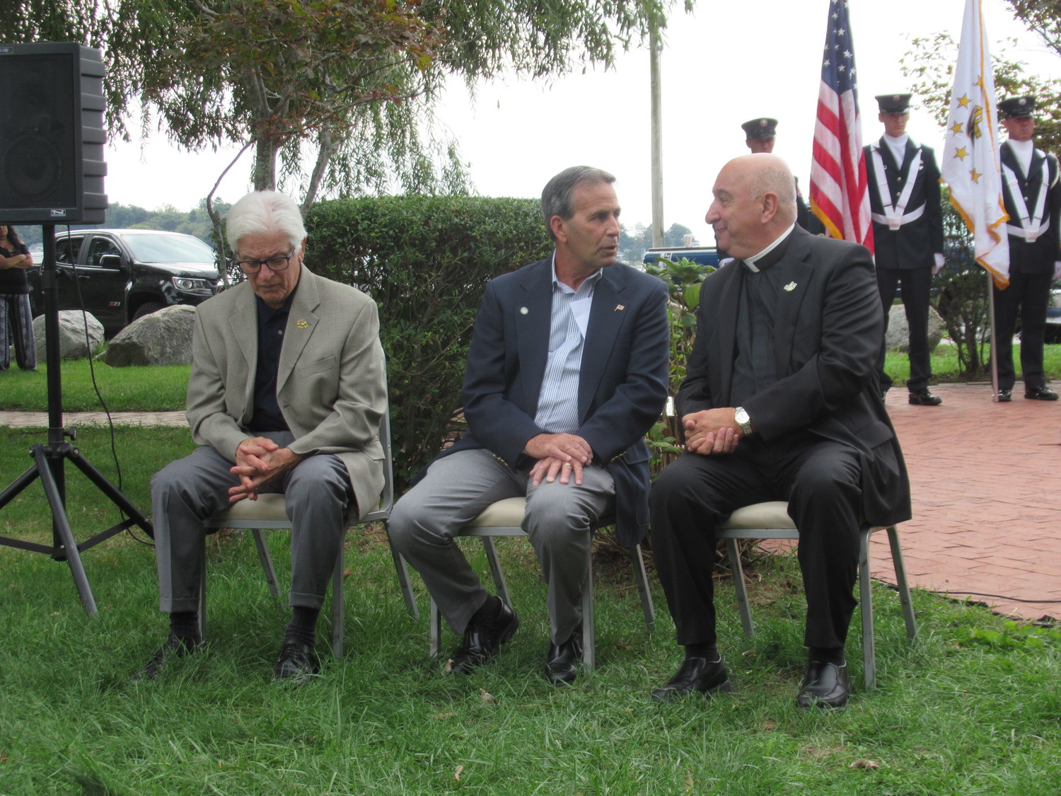 SPECIAL SPEAKERS: Warwick Mayor Frank Picozzi (center), CMSD Sgt. Major Dan Evangelista (left) and Rev. Robert Marciano delivered speeches and prayers during Sunday’s 9/11 remembrance ceremony.