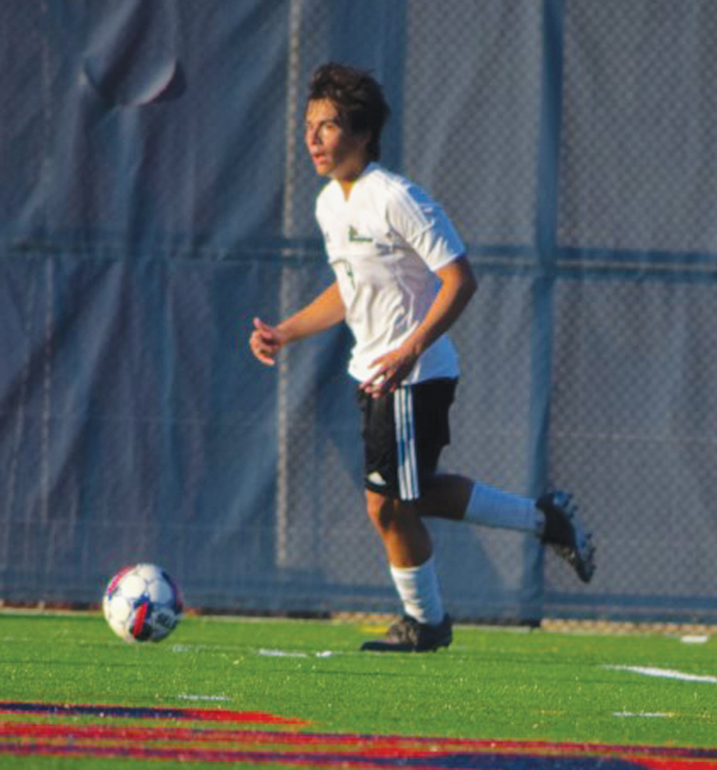 UP THE FIELD: CCRI’s Christian Wilson dribbles the ball.