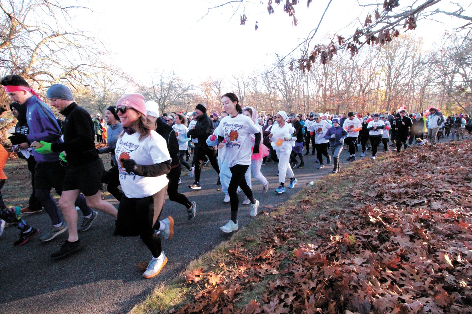 OFF AND RUNNING: On the word for club member Bev Wiley, nearly 400 runners and walkers set off to cover the 5K on City Park trails Thanksgiving morning.