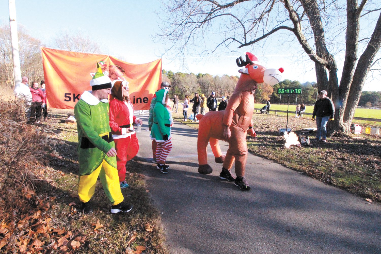 SANTA’S FRIENDS: Even Rudolf joined in the finish line celebration of these trotters.